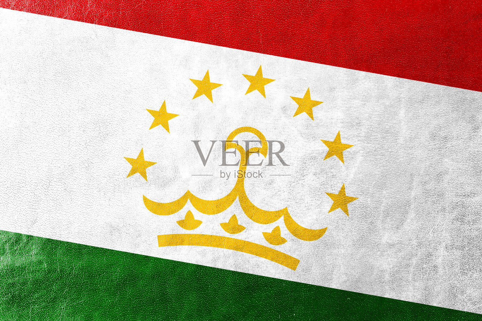 皮革纹理上绘有塔吉克斯坦国旗照片摄影图片