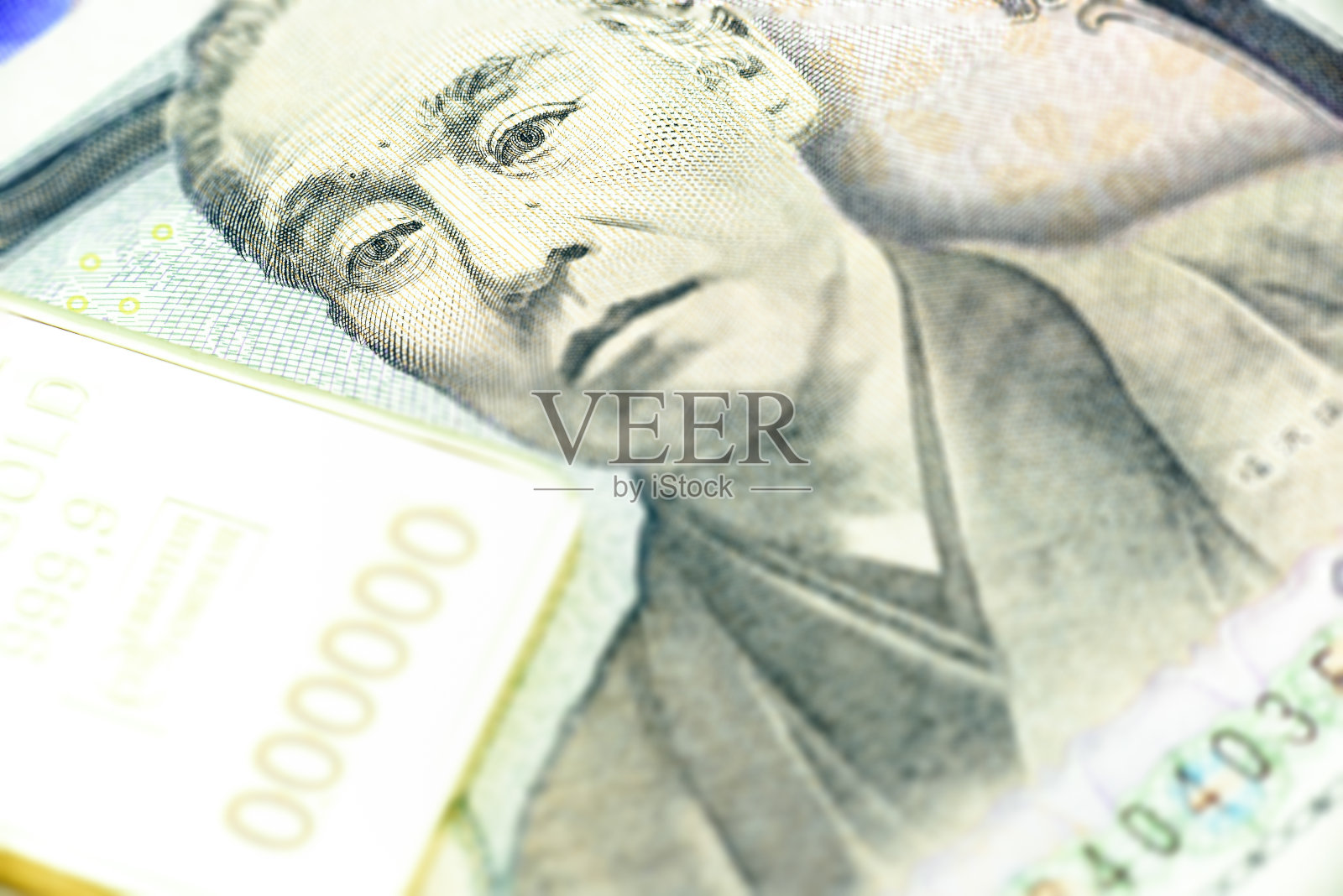 日圆一千元，宏观上用金条特写。照片摄影图片