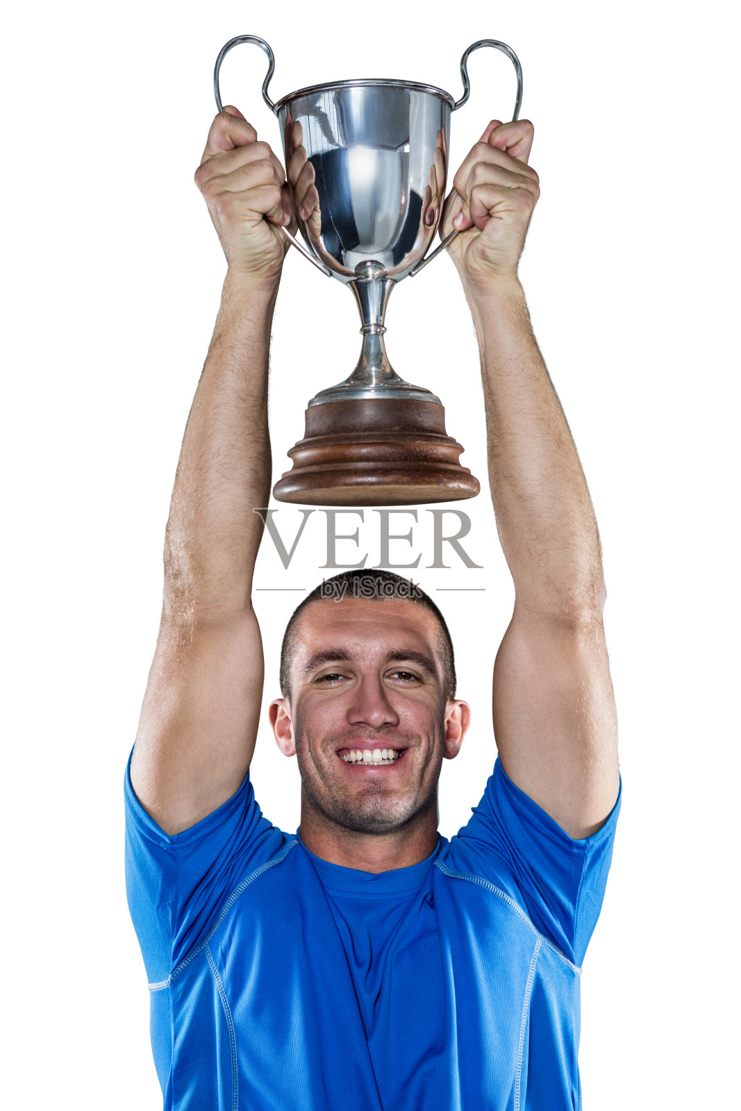 微笑的橄榄球运动员拿着奖杯的肖像照片摄影图片