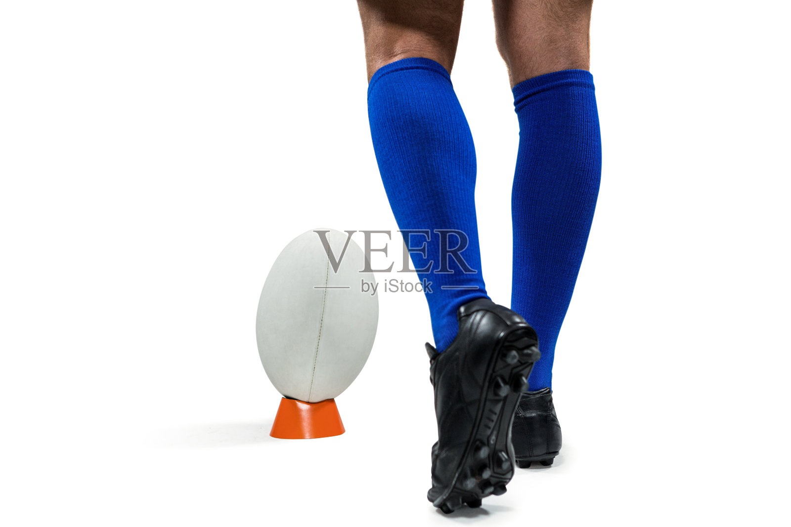 橄榄球运动员正要踢球的下部照片摄影图片