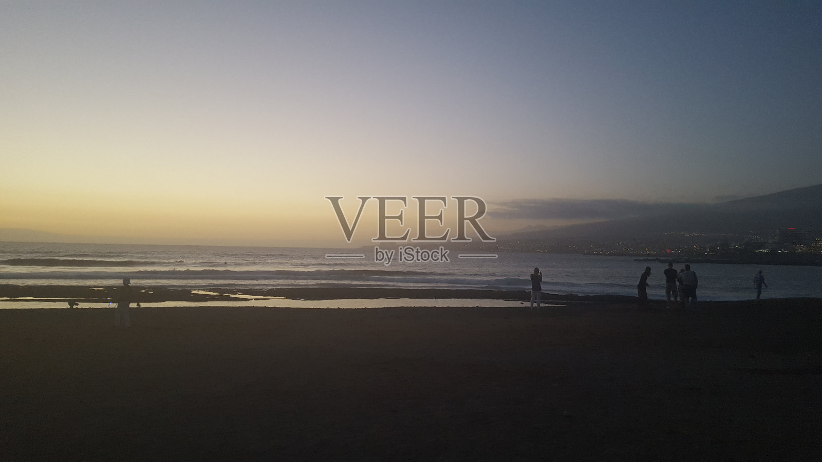 日落海滩上照片摄影图片