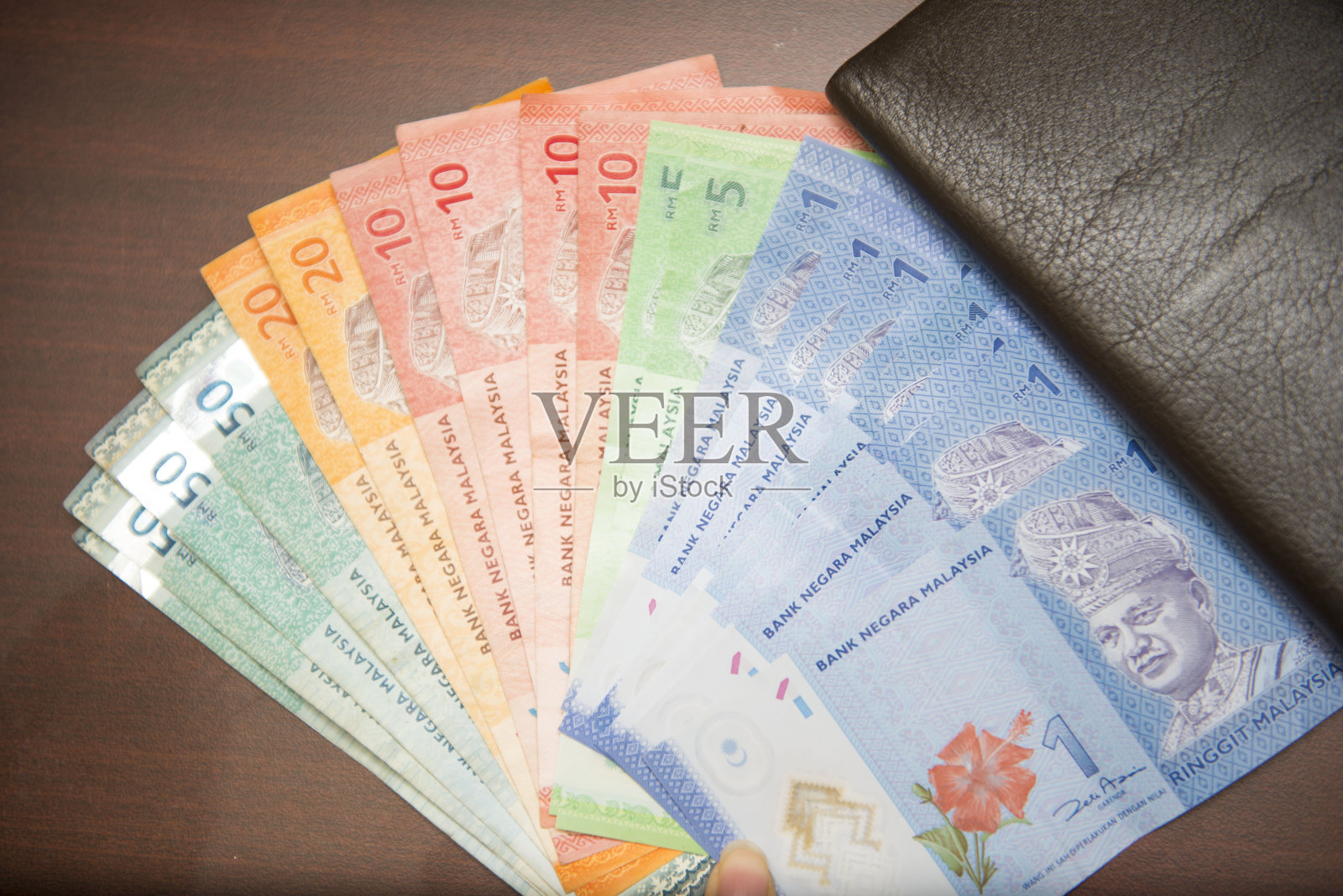 马来西亚钞票带有棕色钱包照片摄影图片