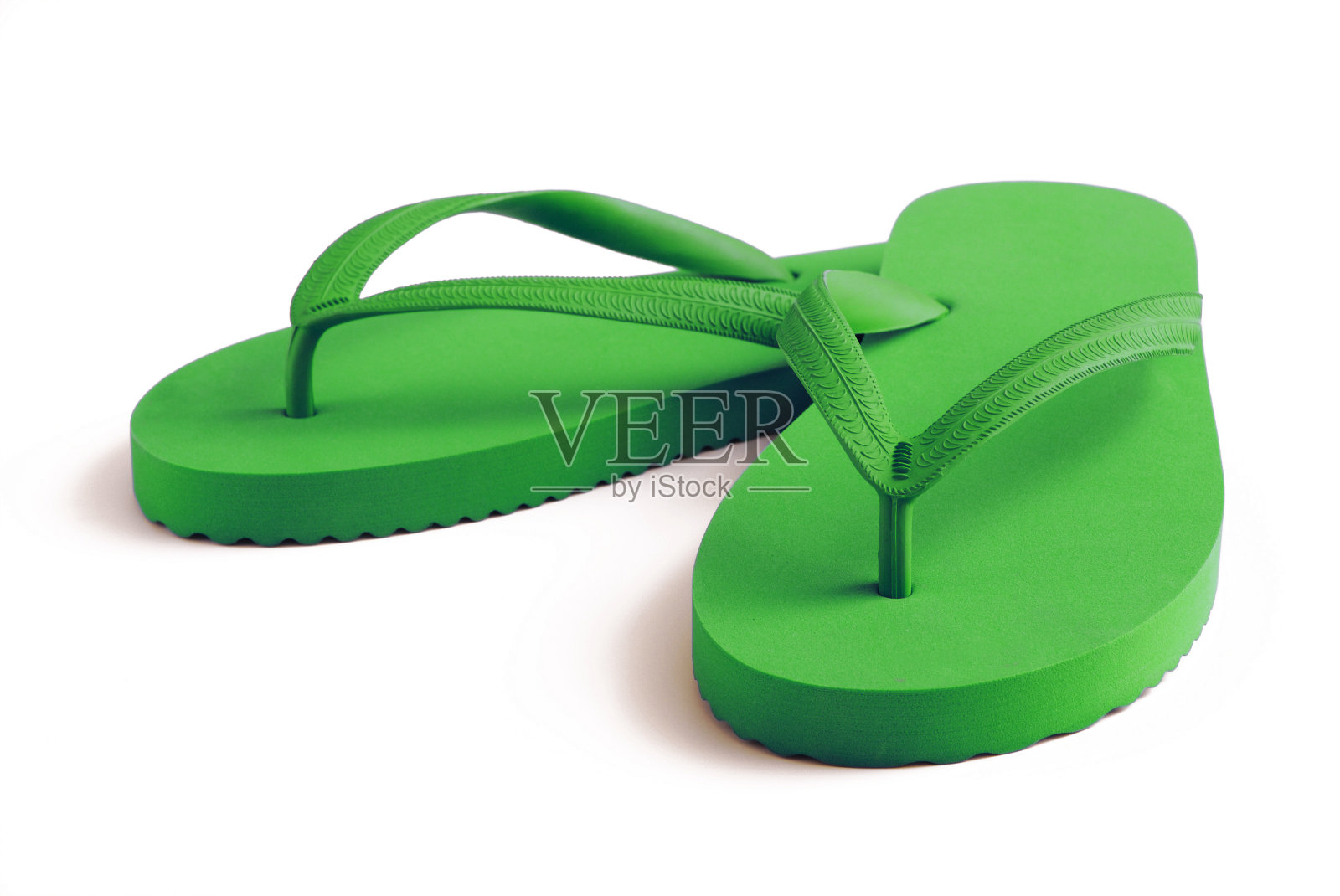 绿色人字拖孤立在白色与柔和的阴影照片摄影图片