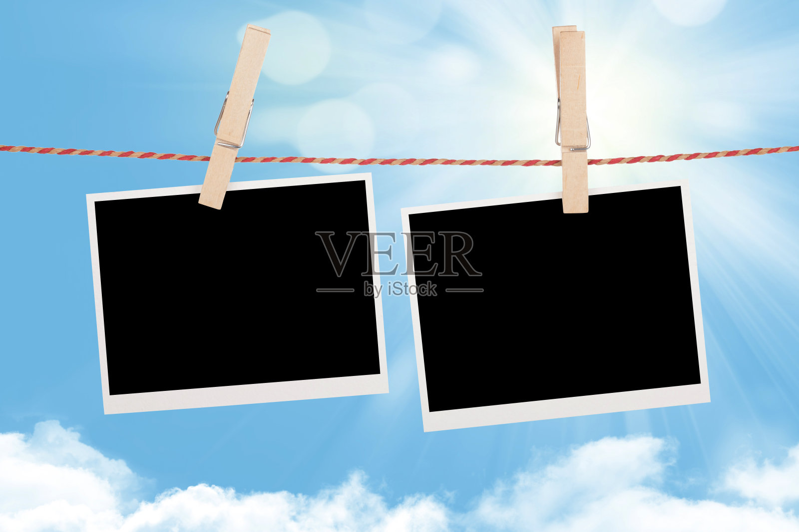 晾衣绳上的空白照片照片摄影图片