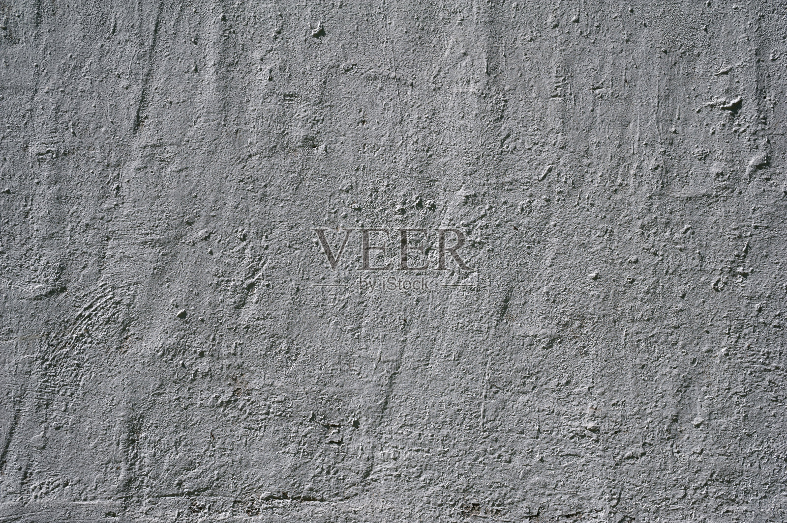 灰色灰泥覆盖的旧墙的纹理照片摄影图片