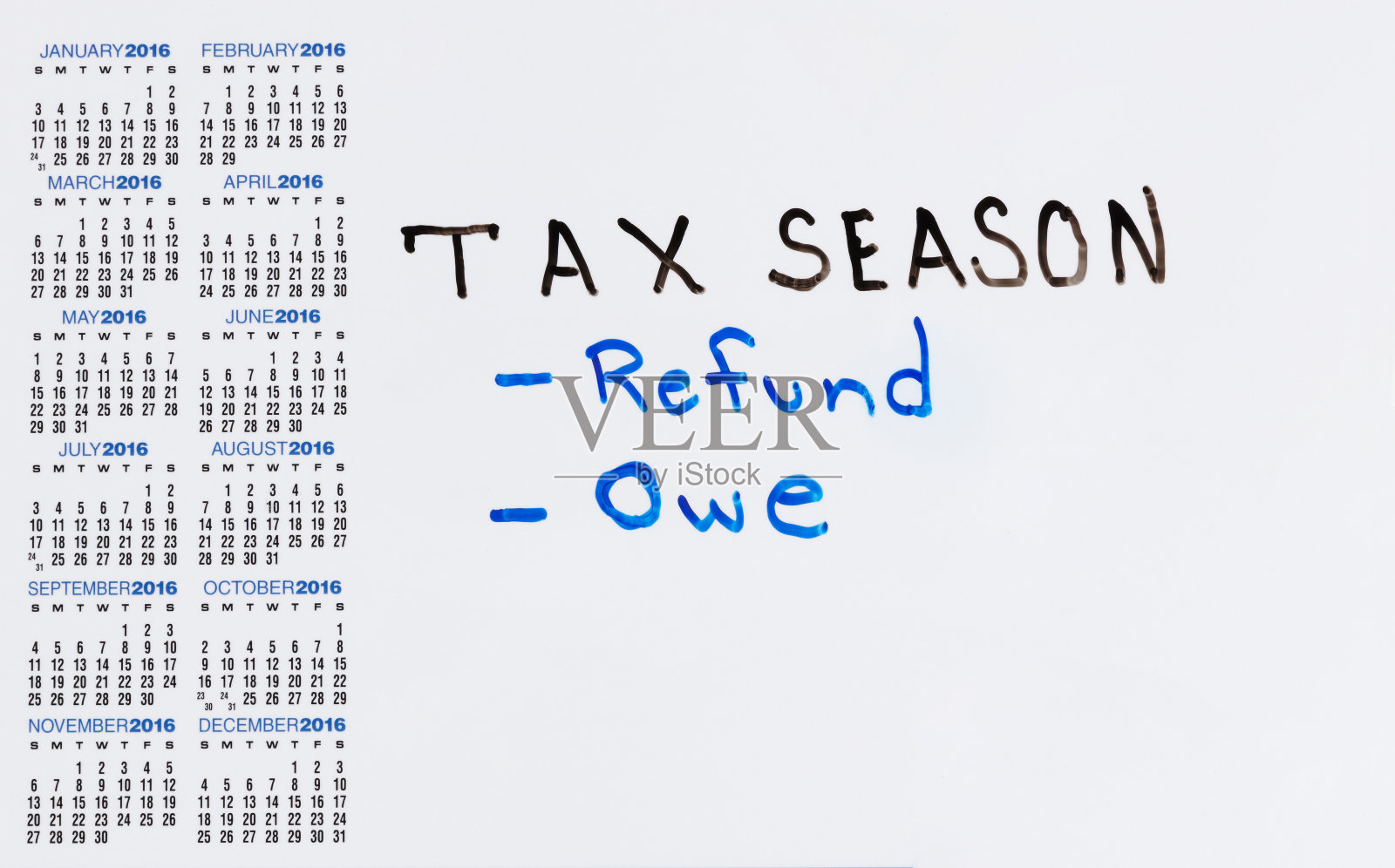 标有税务情况日历的白板照片摄影图片