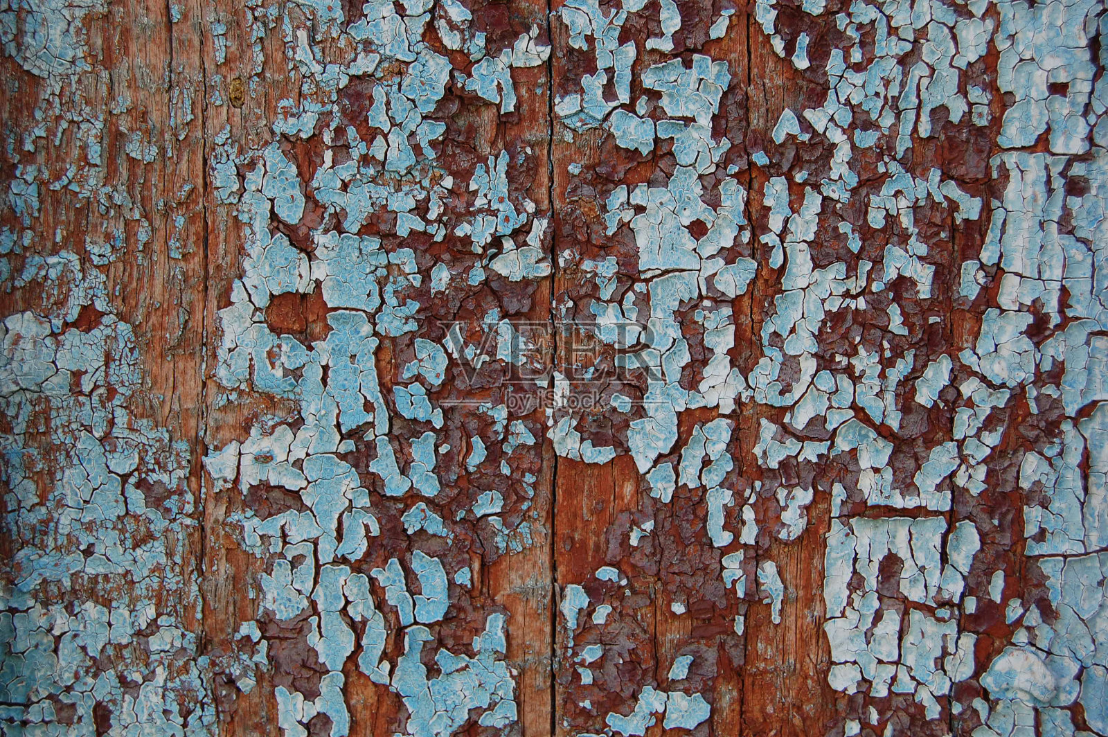 木头背景上有旧的开裂的油漆图案。剥落的油漆。照片摄影图片