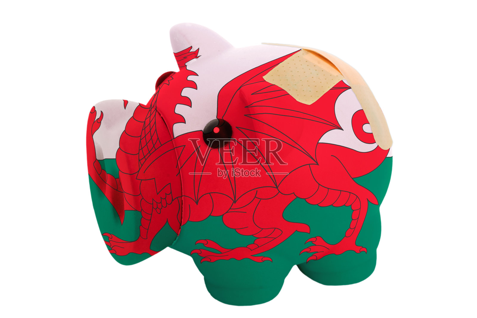 闭合的小猪富有的银行用威尔士的颜色绷带照片摄影图片