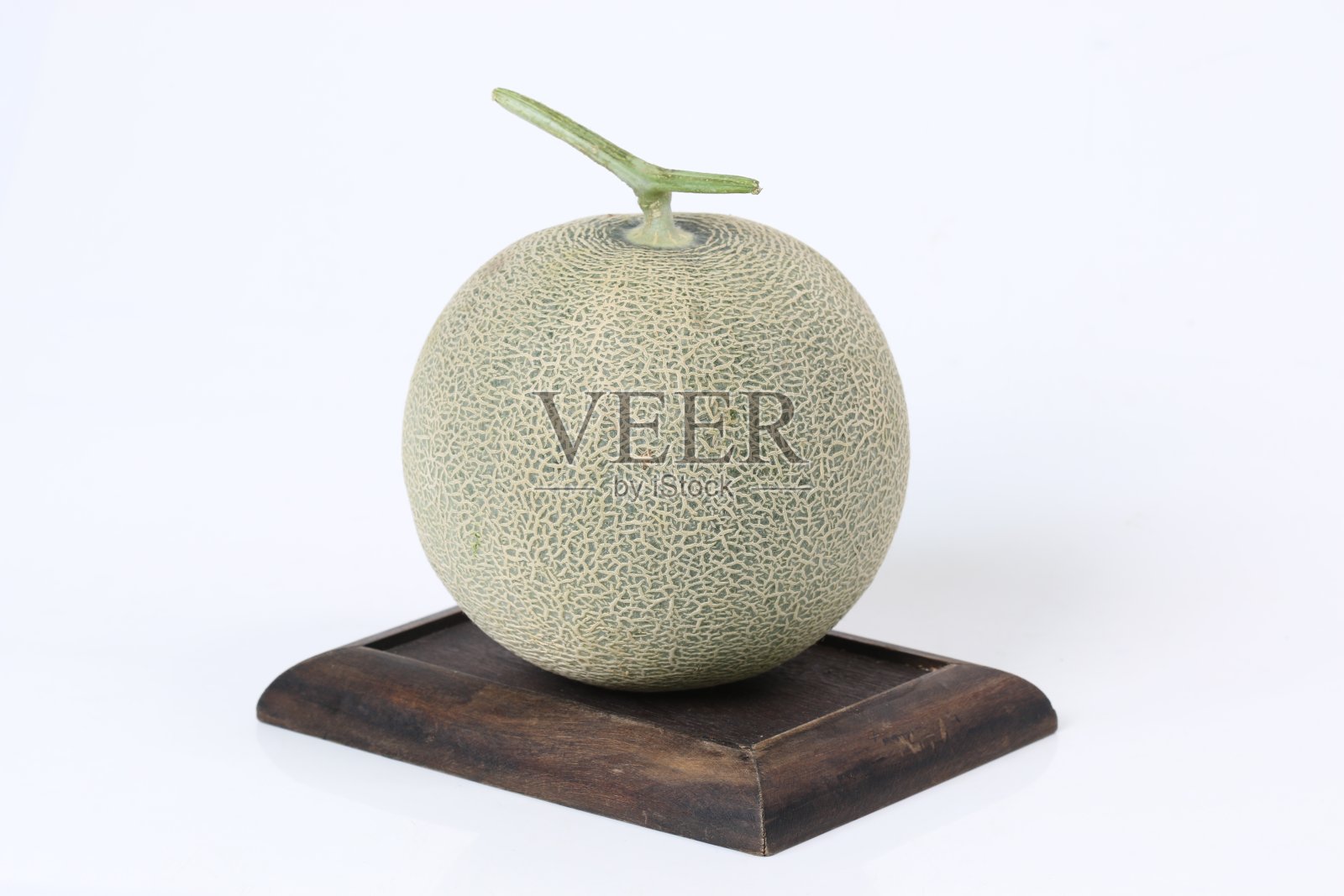 白底上的甜瓜。照片摄影图片