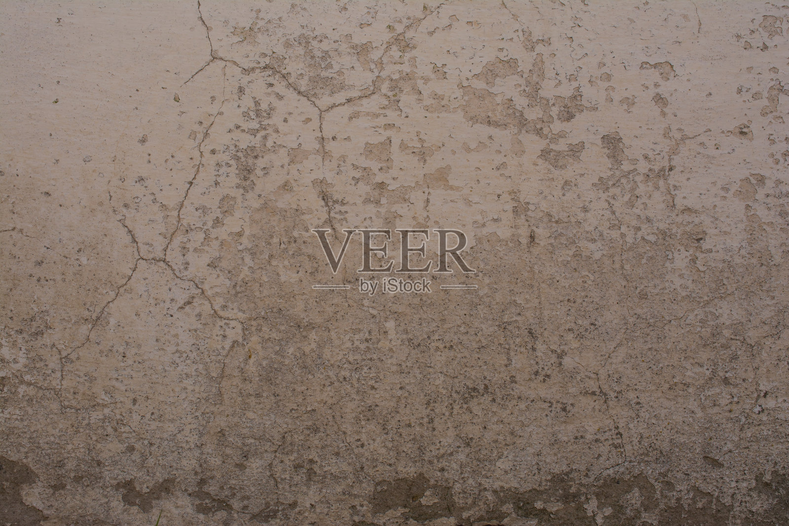 涂有灰泥和贴花的旧砖墙照片摄影图片