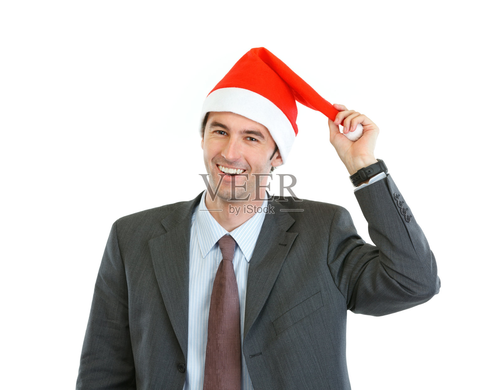 微笑的商人玩圣诞老人的帽子的肖像照片摄影图片