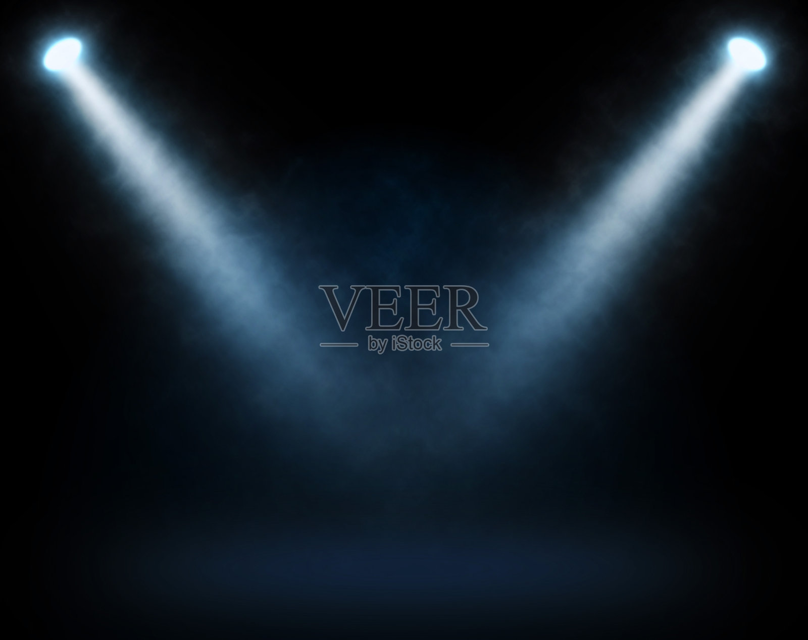 两盏蓝色的聚光灯照在舞台上照片摄影图片