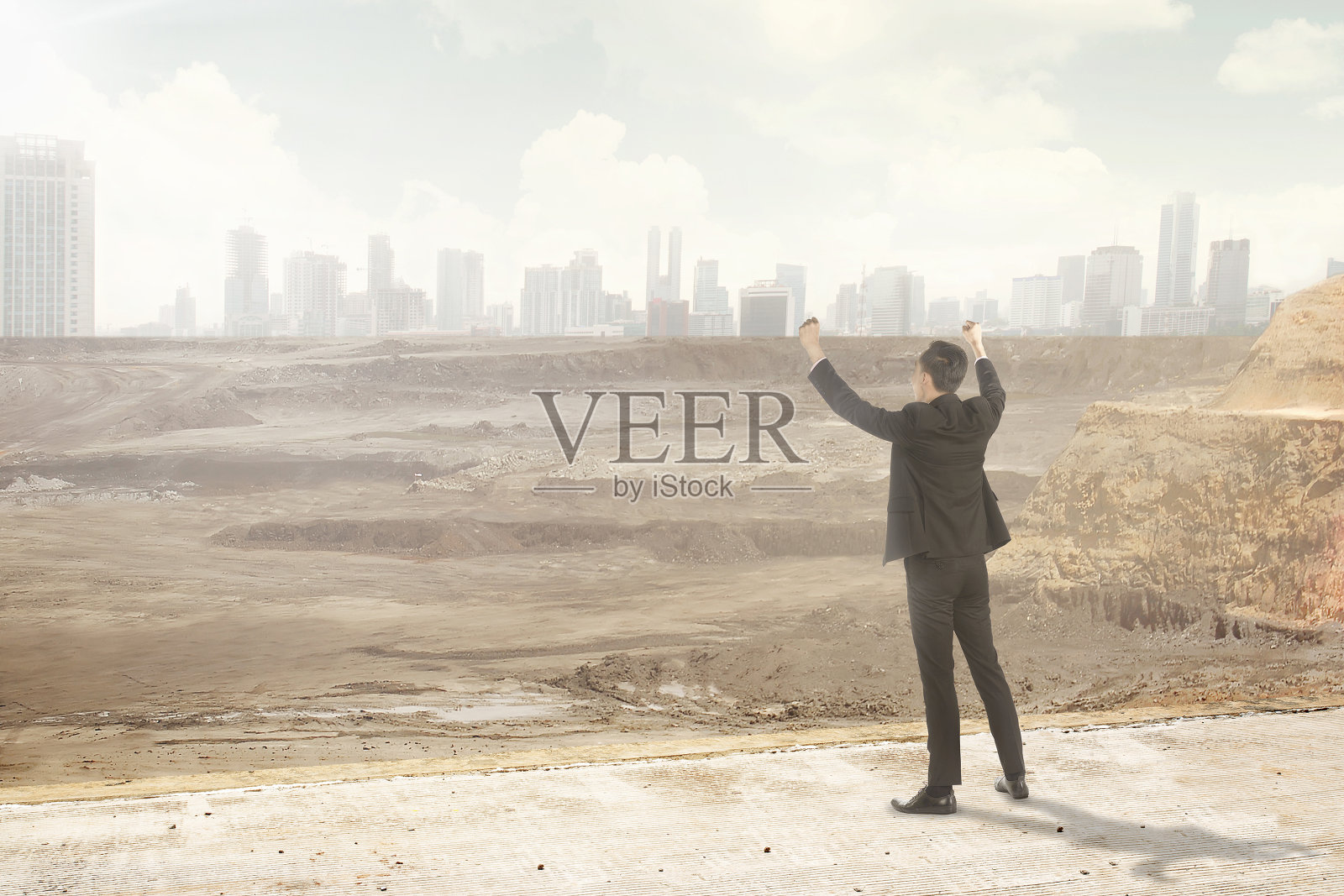 亚洲商人看着被摧毁的城市照片摄影图片