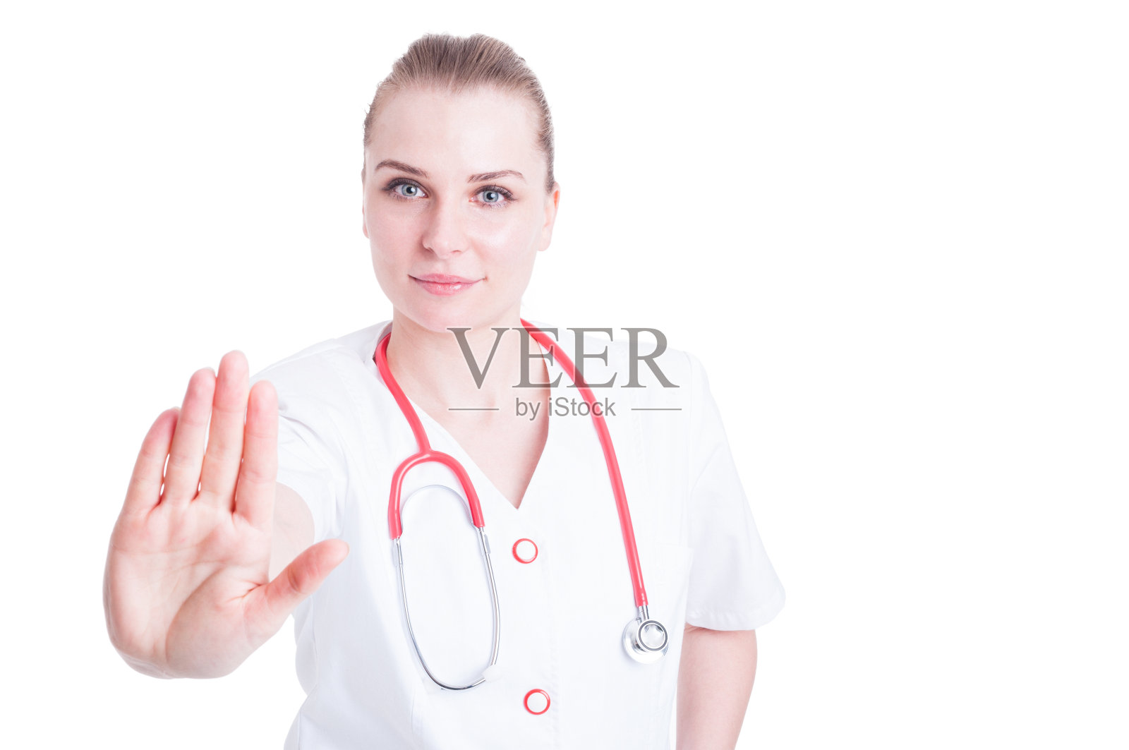 漂亮的女医生用听诊器做停止手势照片摄影图片