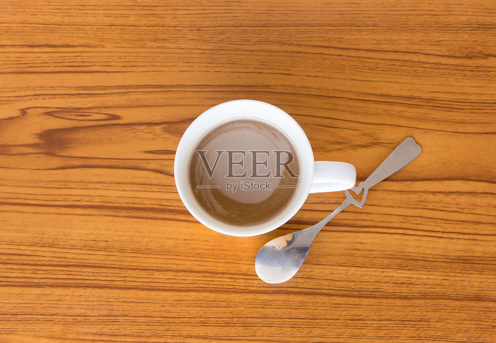 桌上有杯咖啡，俯视图照片摄影图片