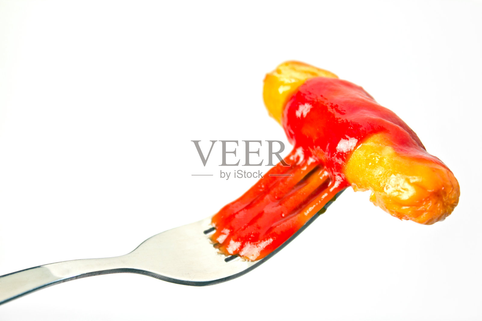 香肠，用叉子戳。照片摄影图片