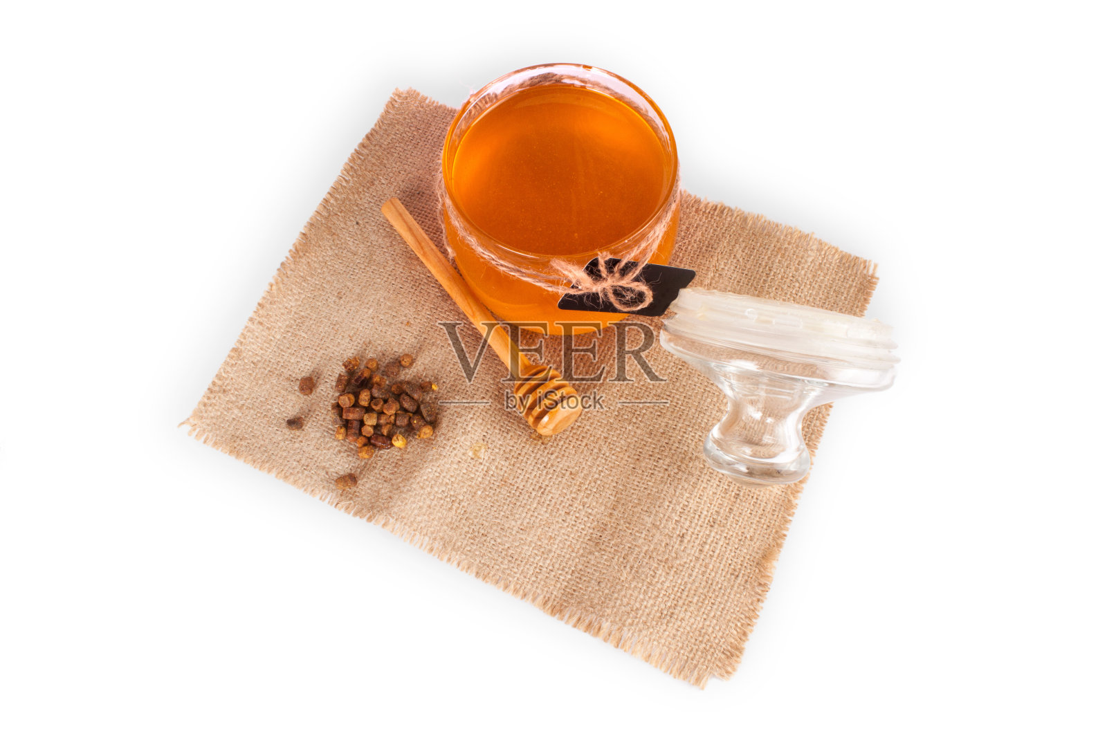 蜂蜜罐和蜂蜜勺照片摄影图片