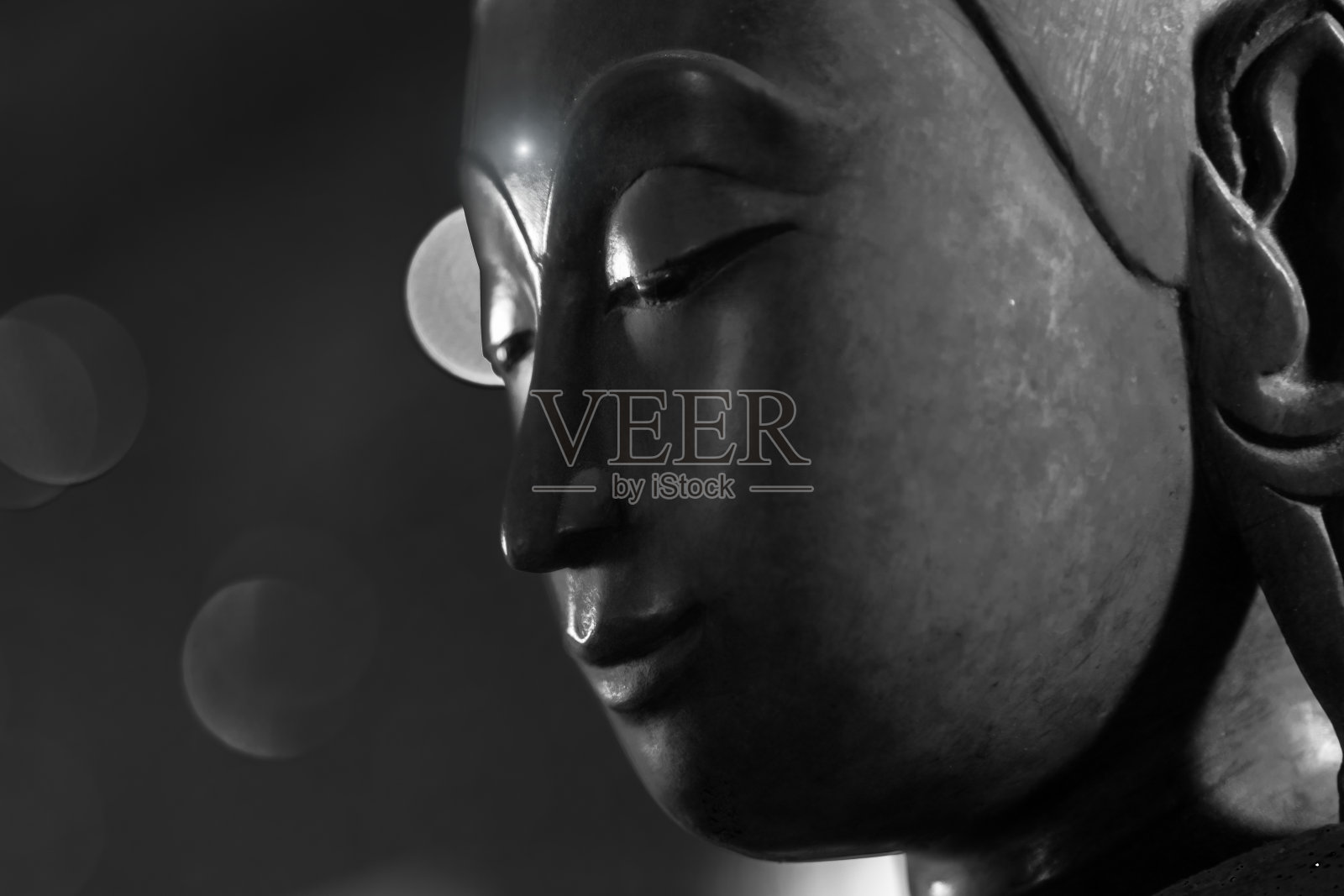 近脸佛的头。照片摄影图片