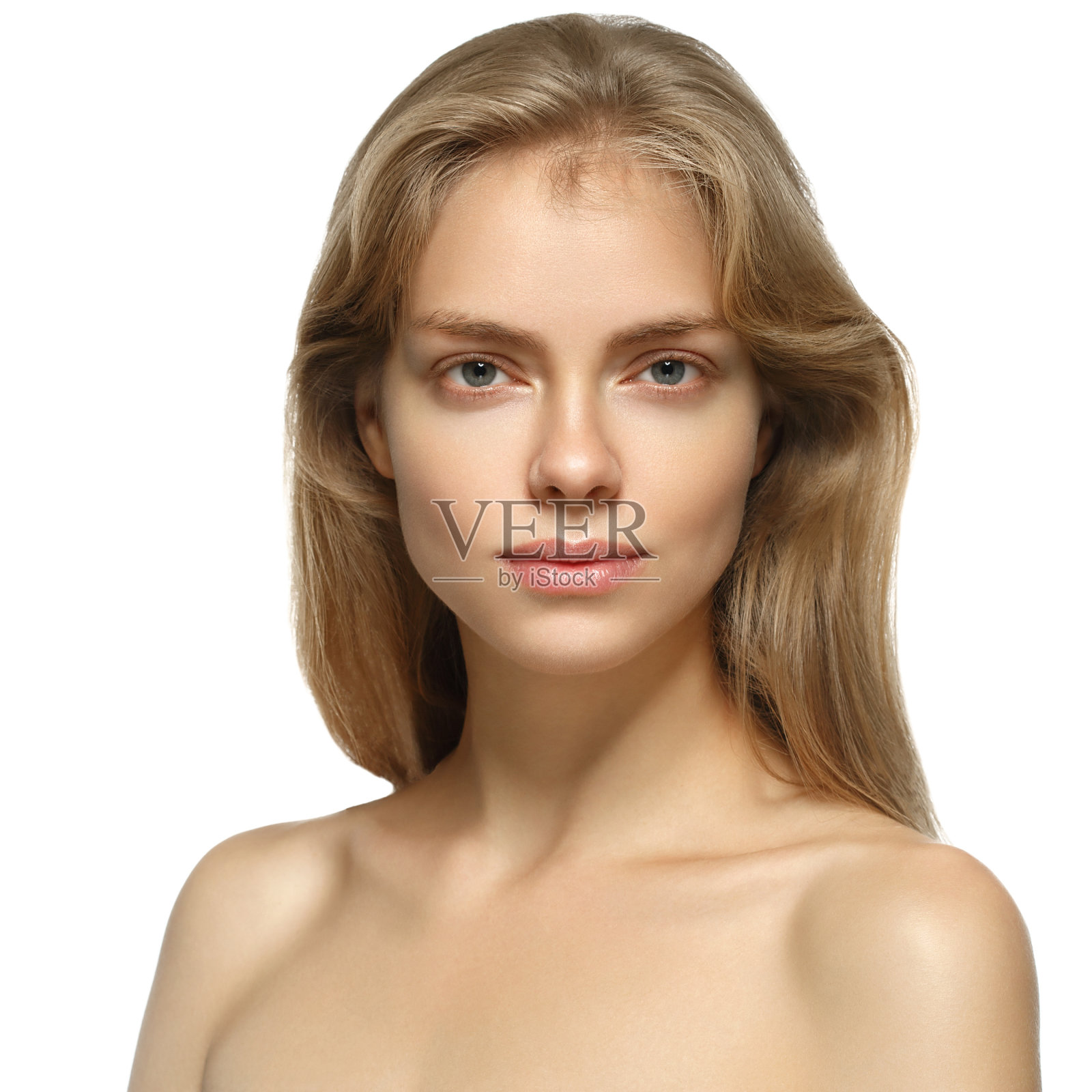 漂亮的金发女人，有着完美的皮肤。孤立在白色的。照片摄影图片