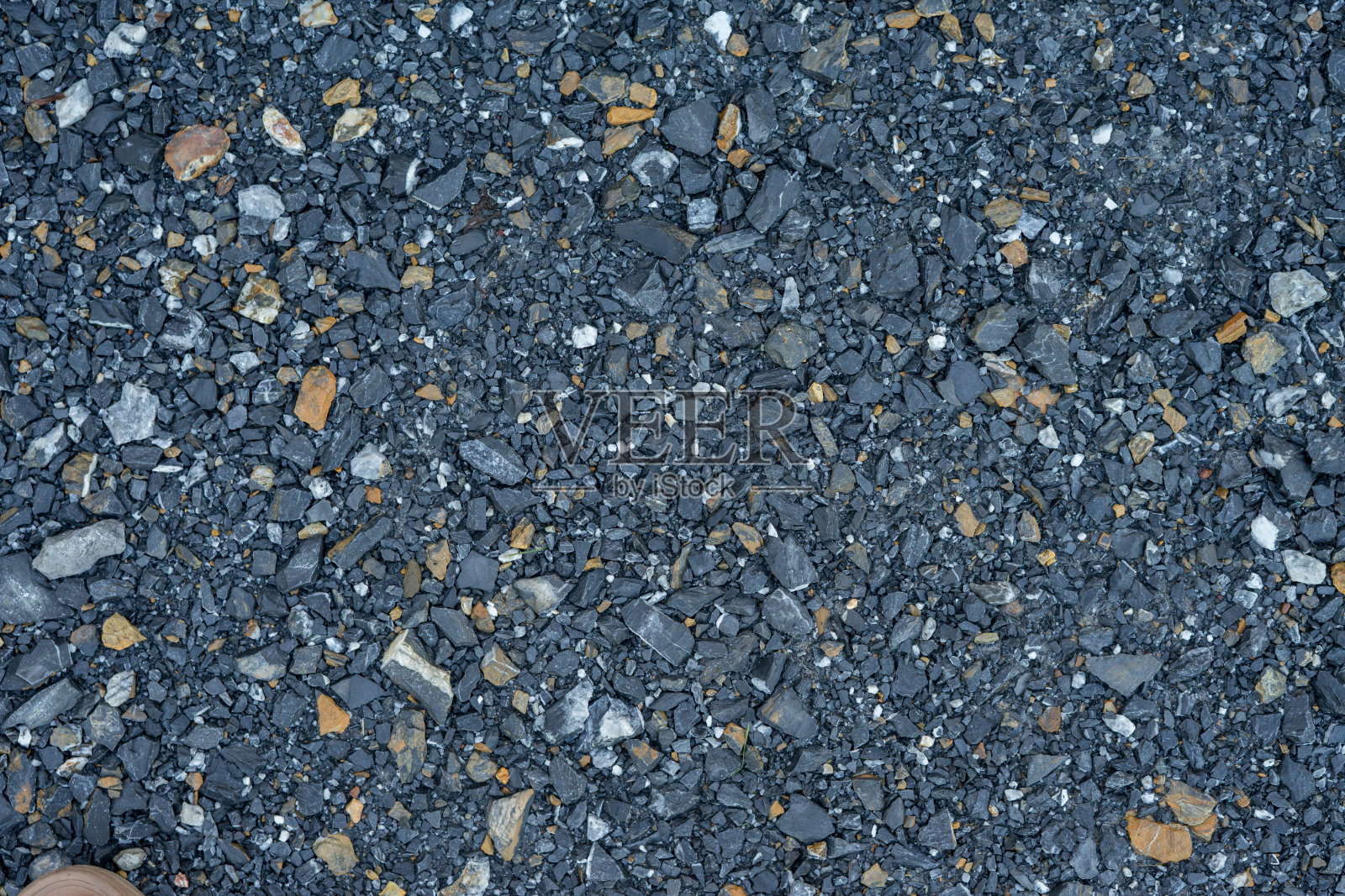 小石子的模式。小石子的背景。小石子纹理。碎的灰色石头。照片摄影图片