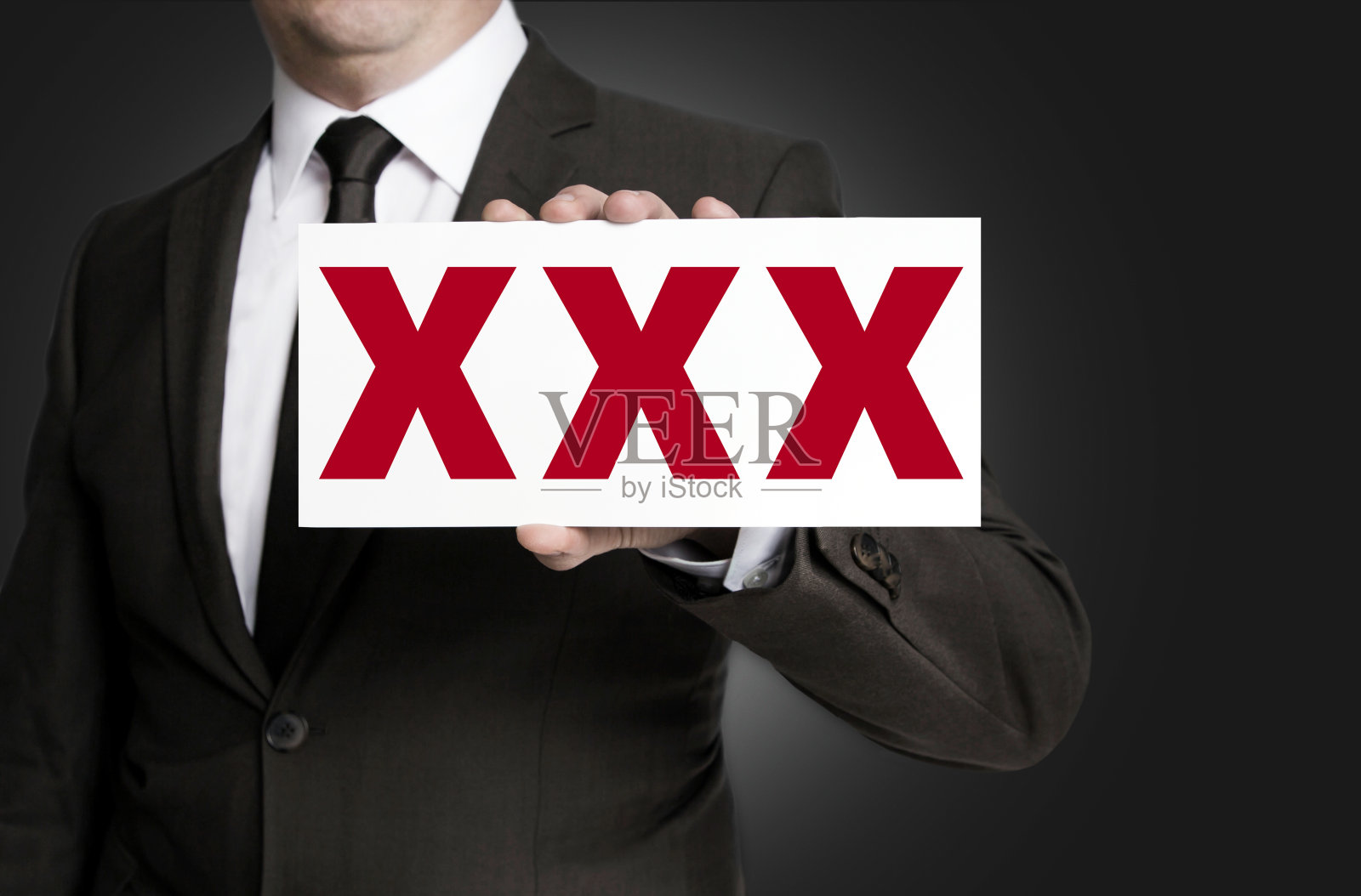 XXX标志由商人背景持有照片摄影图片