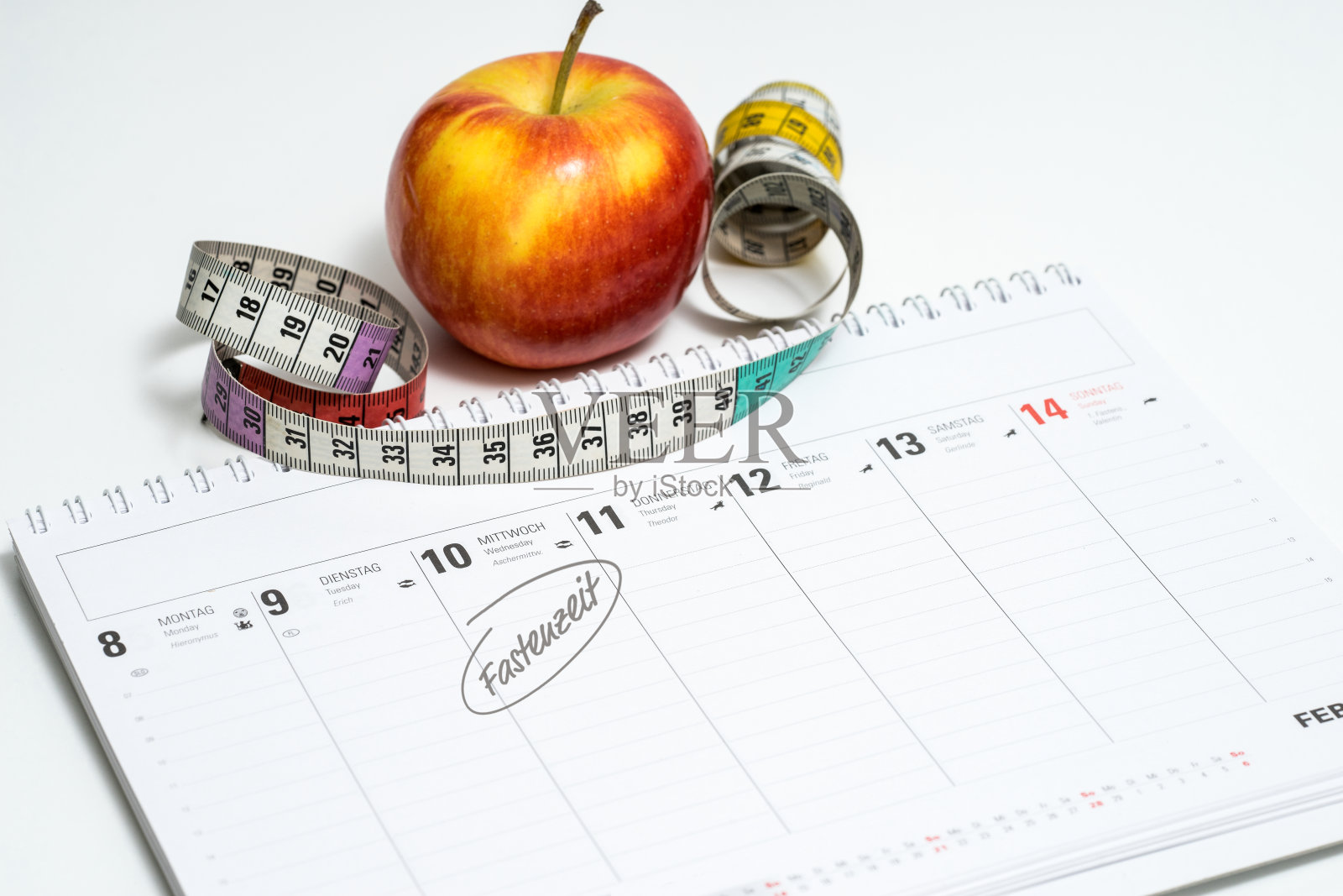 日历(Fastenzeit)与苹果，卷尺照片摄影图片
