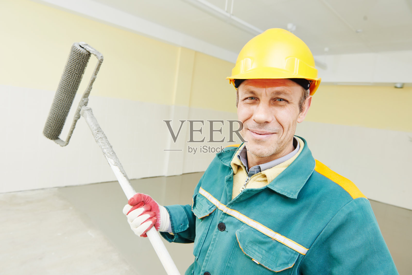 带滚轴的地板工人照片摄影图片