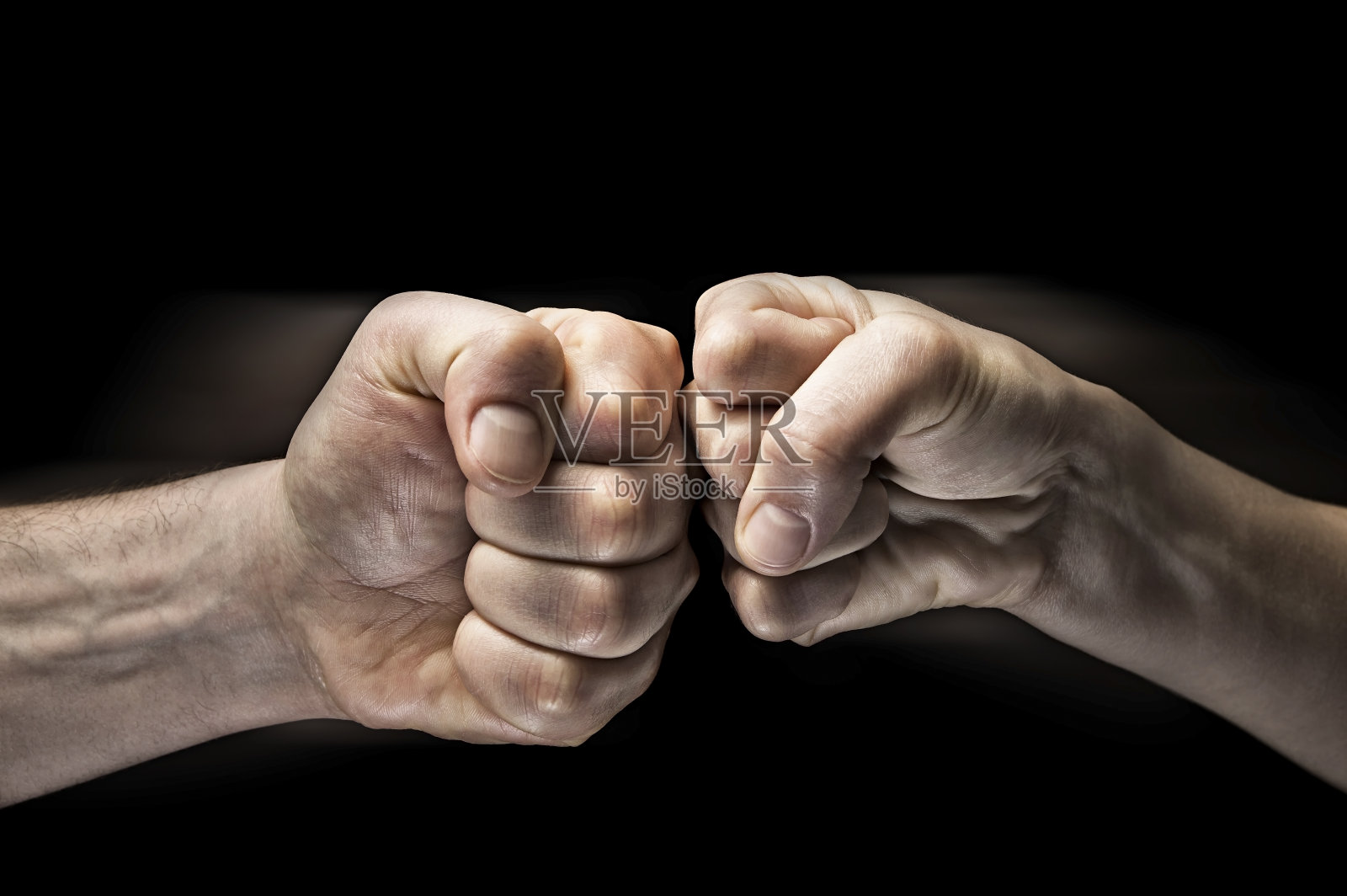 双拳碰撞照片摄影图片