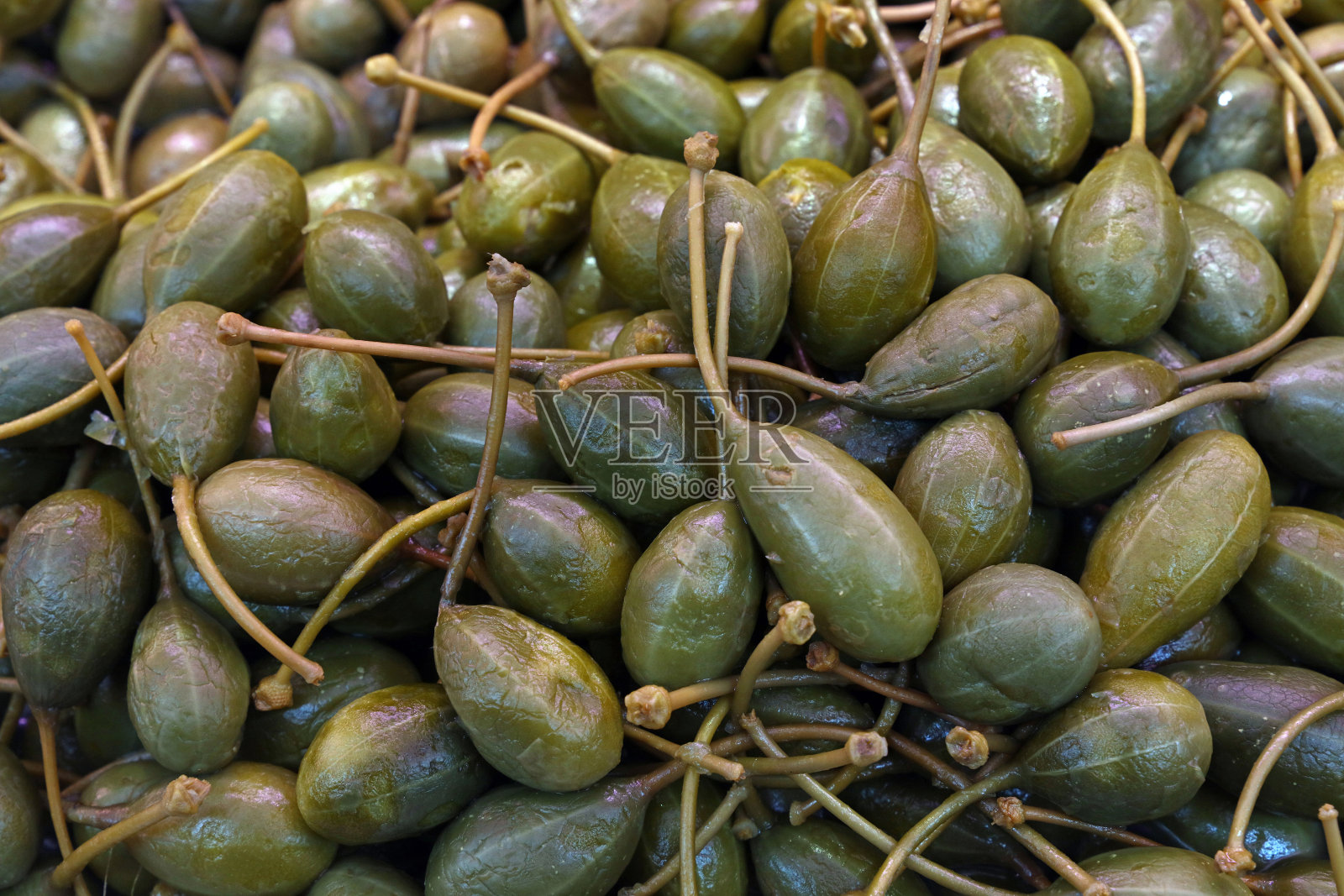 绿色腌大酸豆近距离背景照片摄影图片