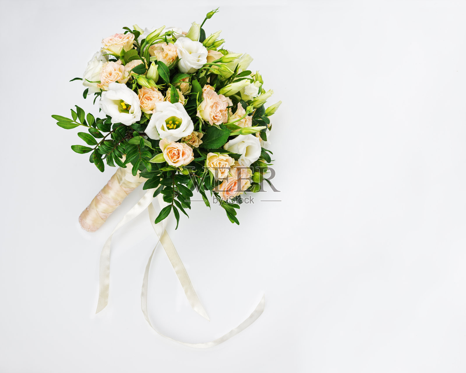 新娘花束:玫瑰、开心果和开心果。照片摄影图片
