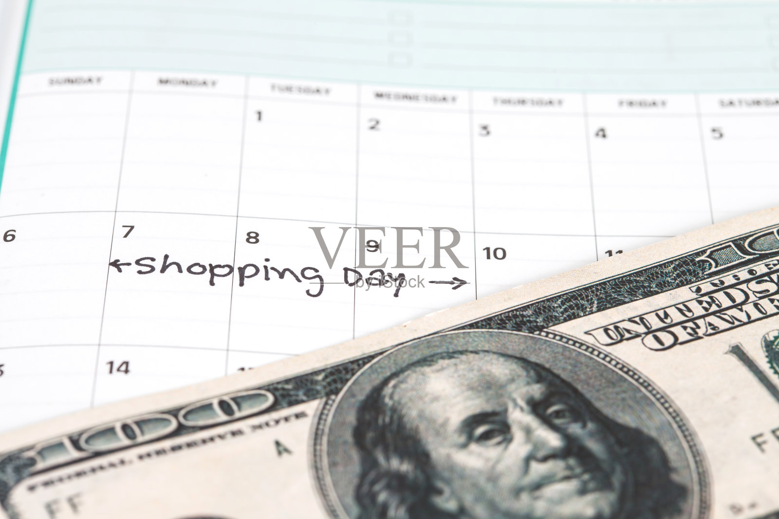 钱在日历上的概念日期为购物照片摄影图片