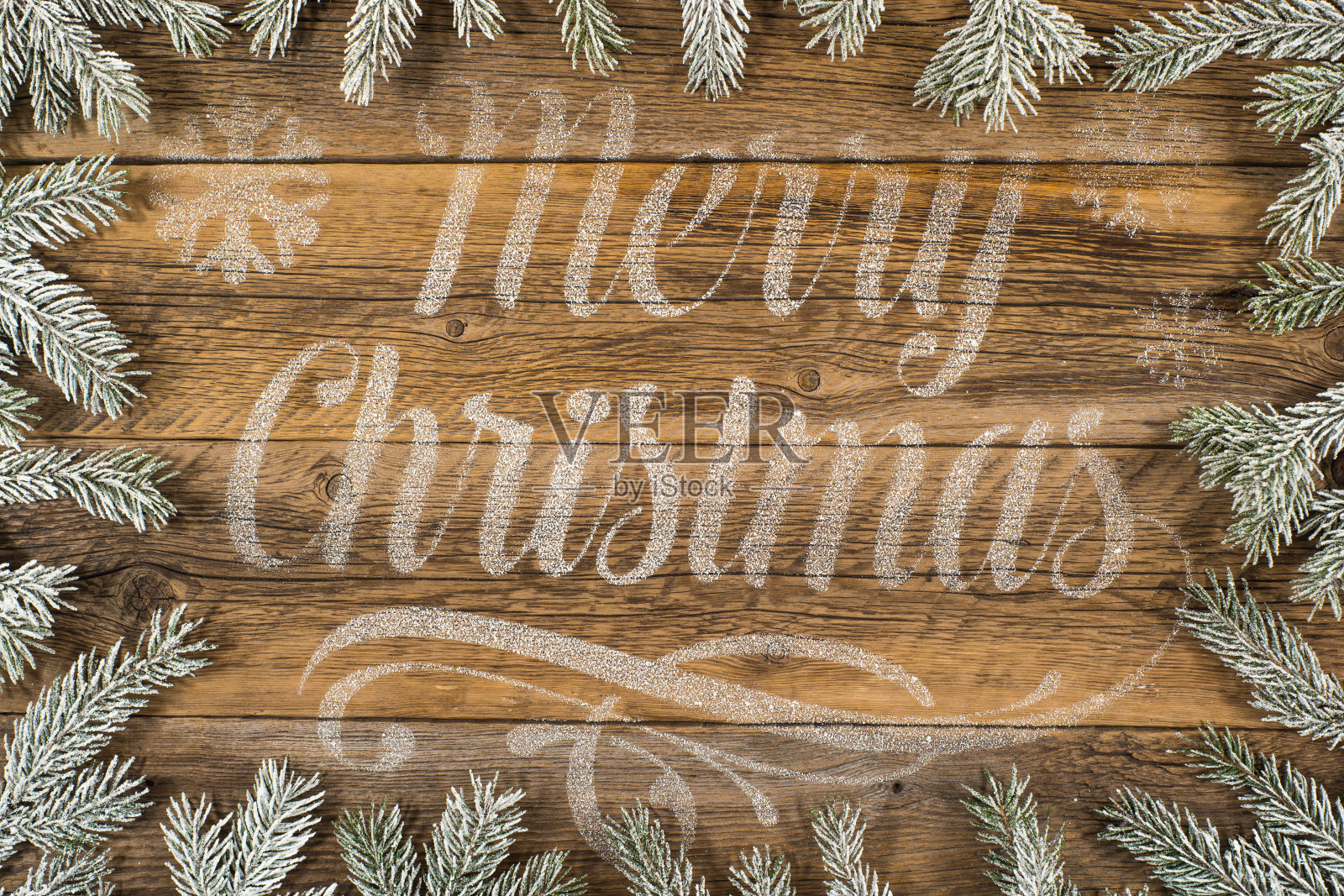 旧木纹背景上的圣诞快乐祝福语照片摄影图片