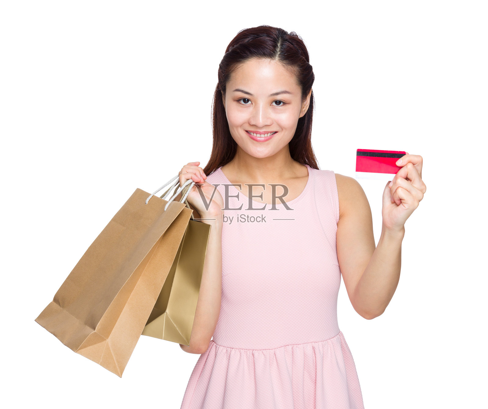 拿着购物袋拿着信用卡的女人照片摄影图片
