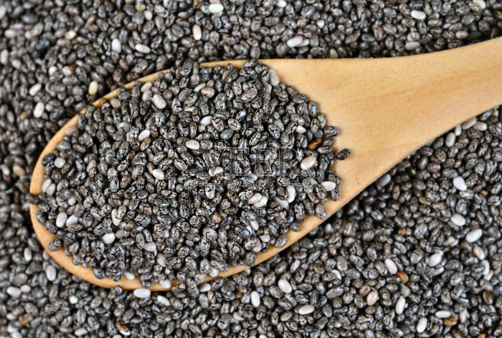 木勺里的奇异籽照片摄影图片