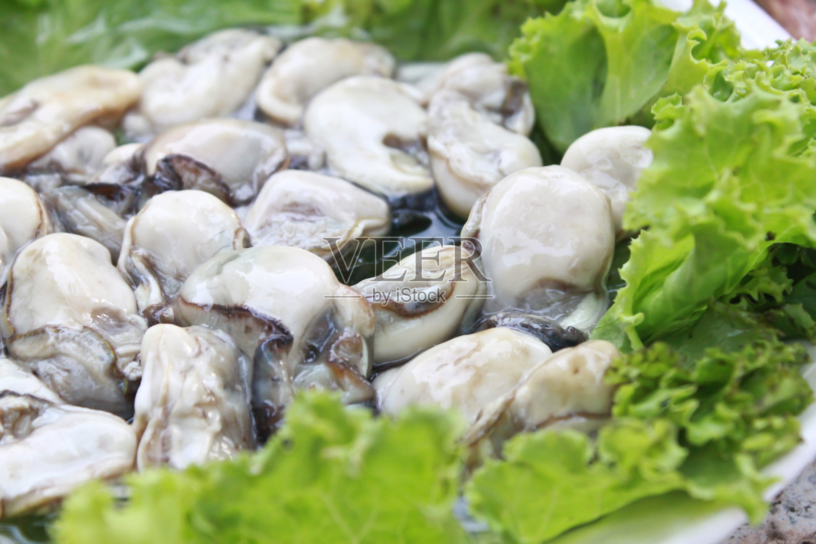 牡蛎剥皮特写照片摄影图片