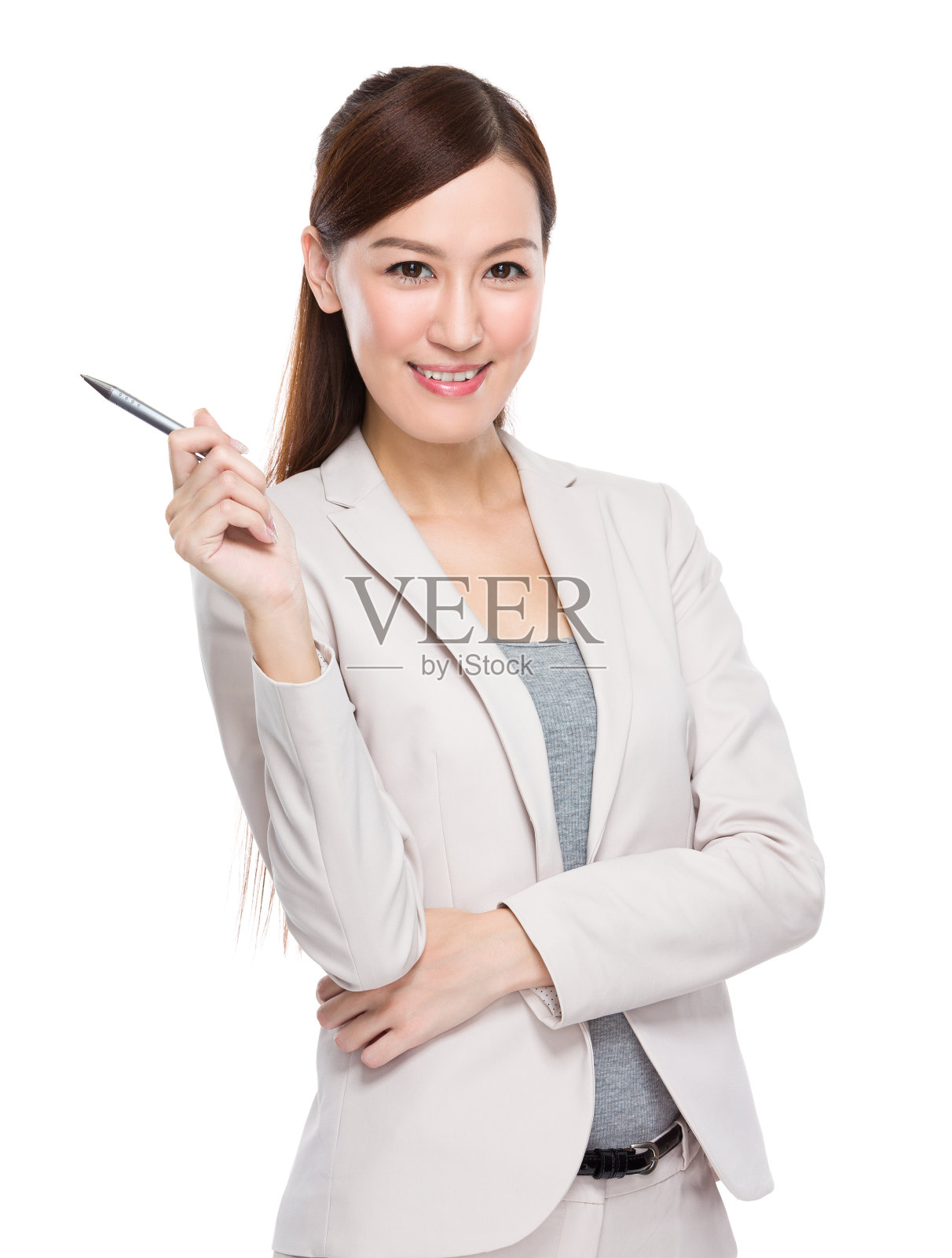 中国女商人用笔指着照片摄影图片