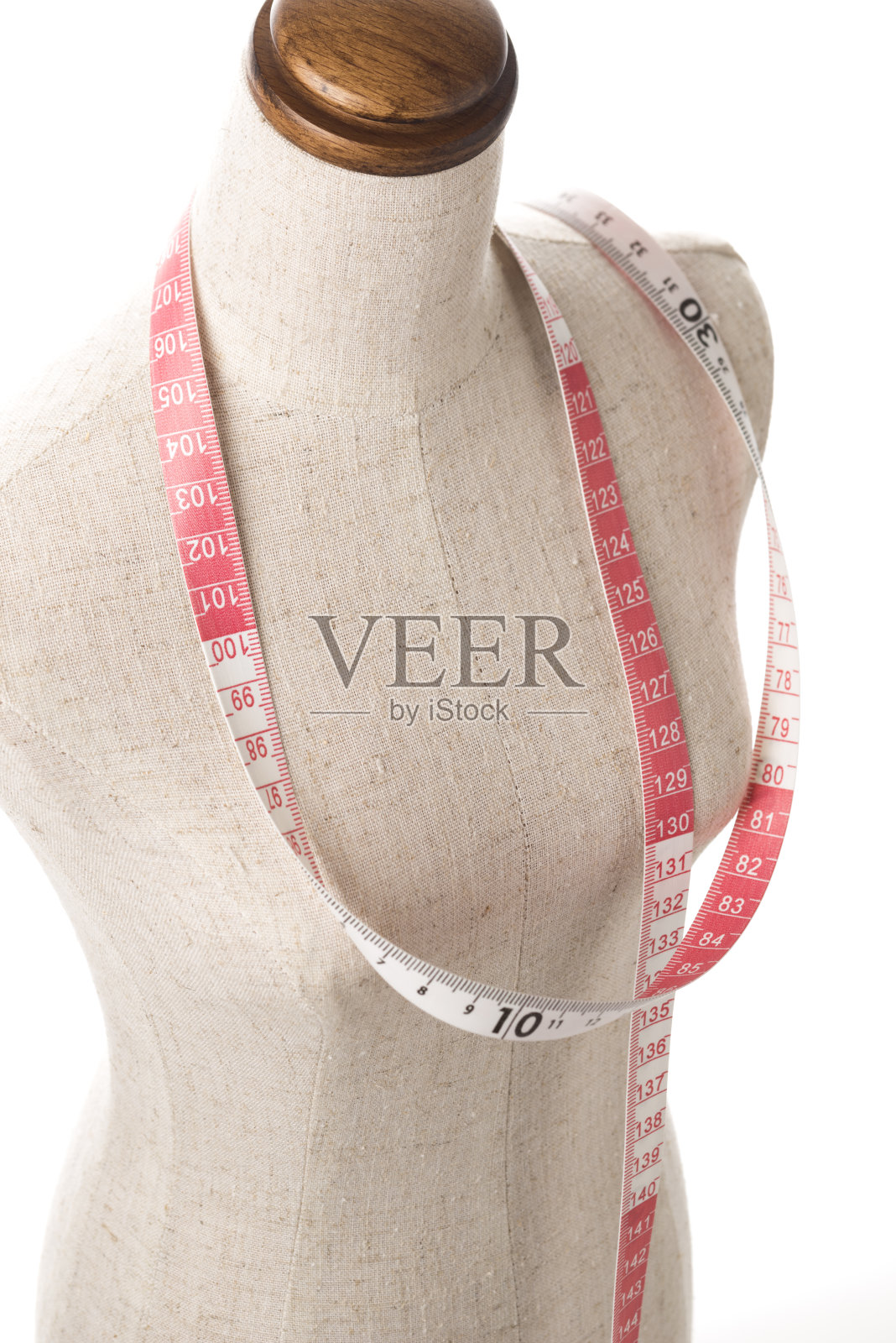 带着卷尺的人体模型，特写照片摄影图片