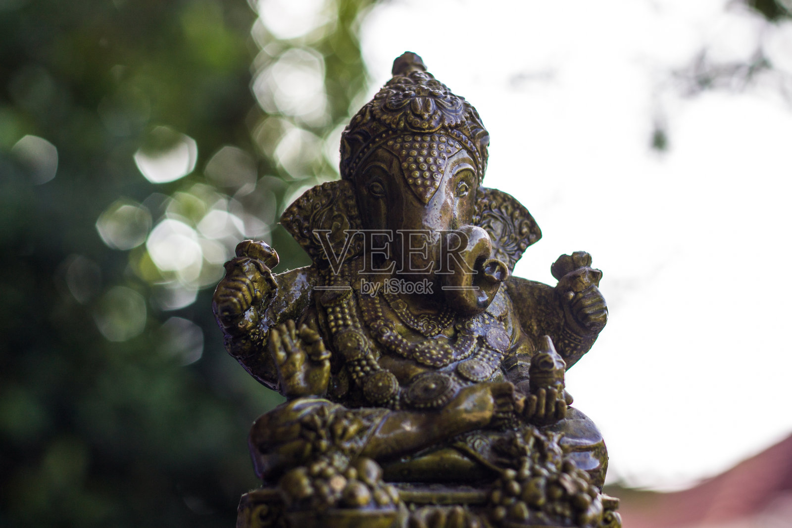 甘尼萨雕像和菩萨照片摄影图片