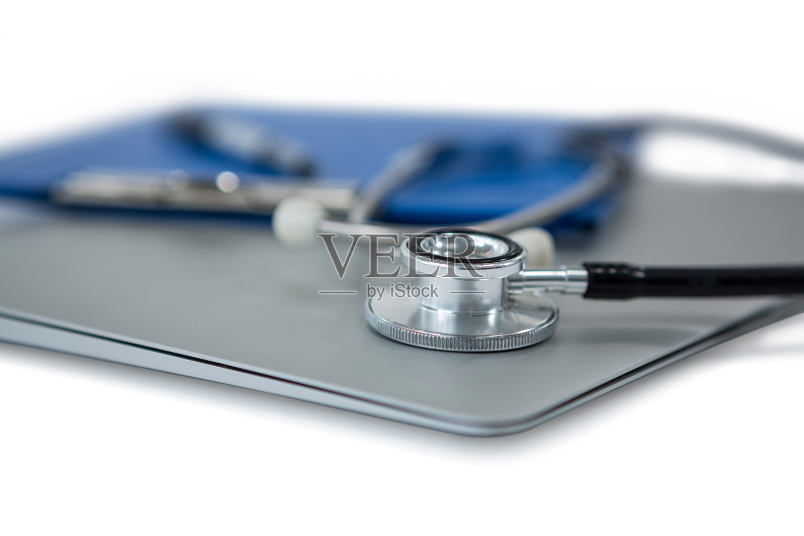 笔记本上听诊器的特写照片摄影图片