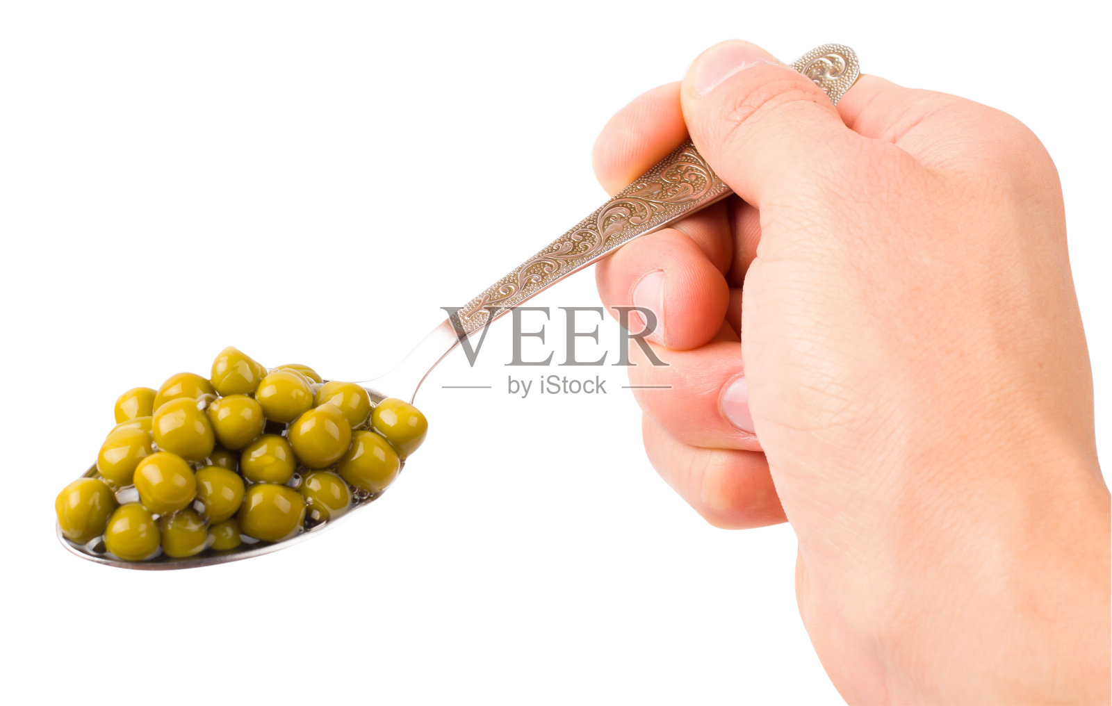 用勺子舀绿豌豆照片摄影图片