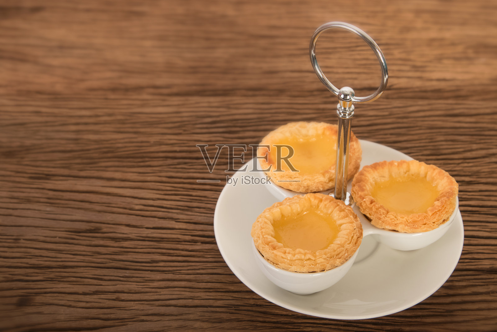 蛋挞的木制背景照片摄影图片