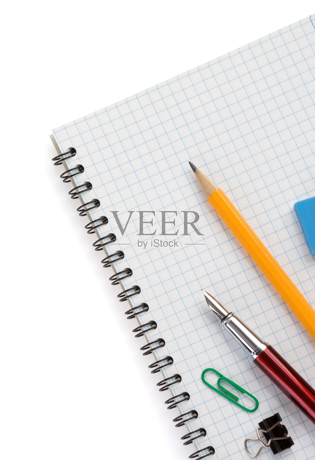 检查笔记本上的学习用品照片摄影图片