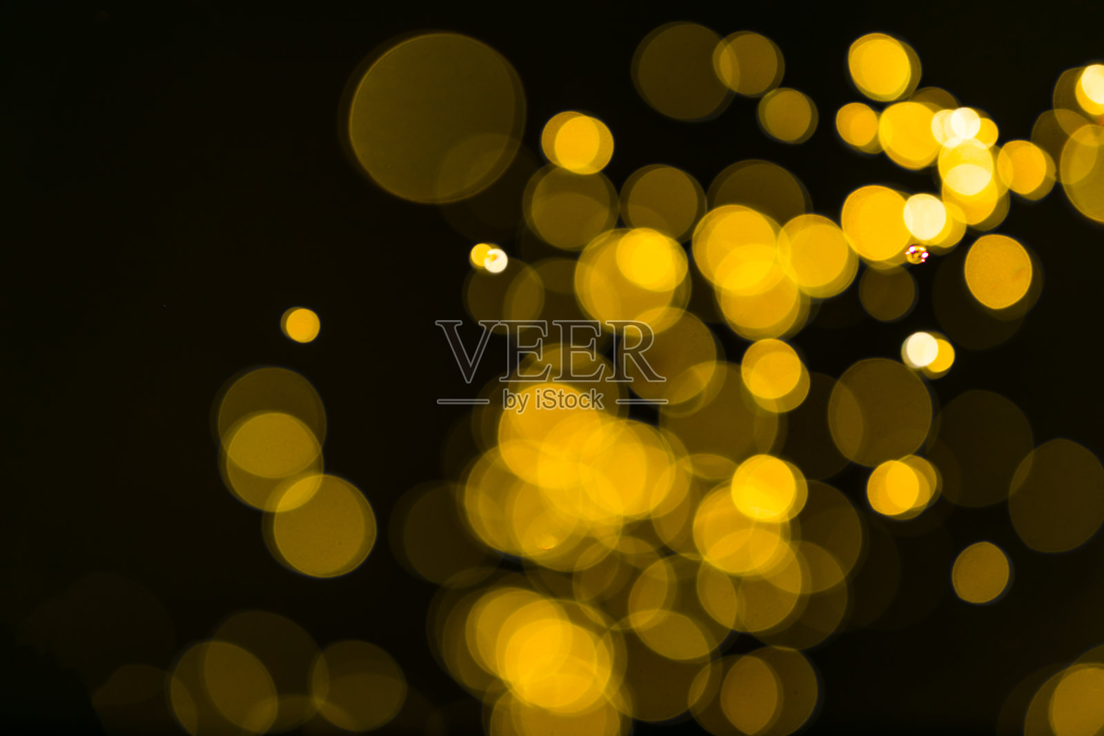 闪烁的复古灯光背景。暗金色和黑色。defocuse照片摄影图片