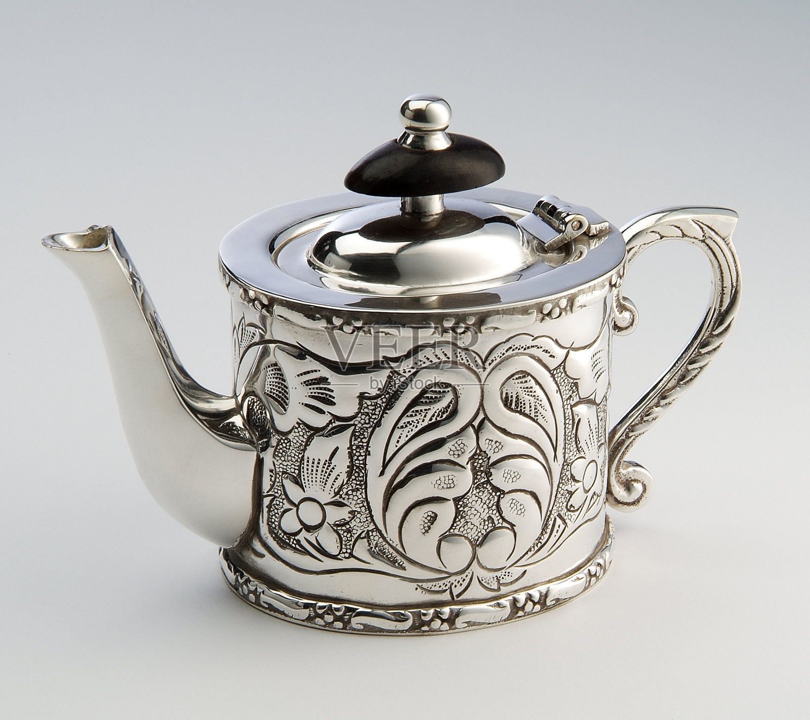 轮廓鲜明的银茶壶照片摄影图片