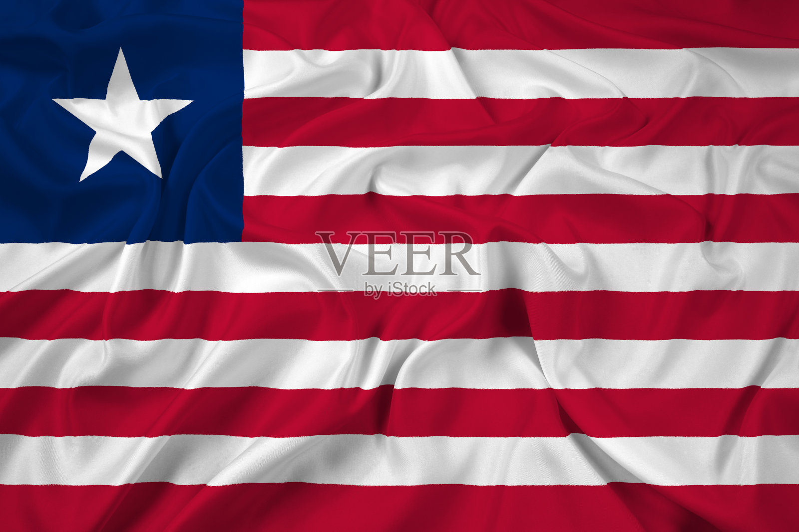 挥舞着利比里亚国旗照片摄影图片