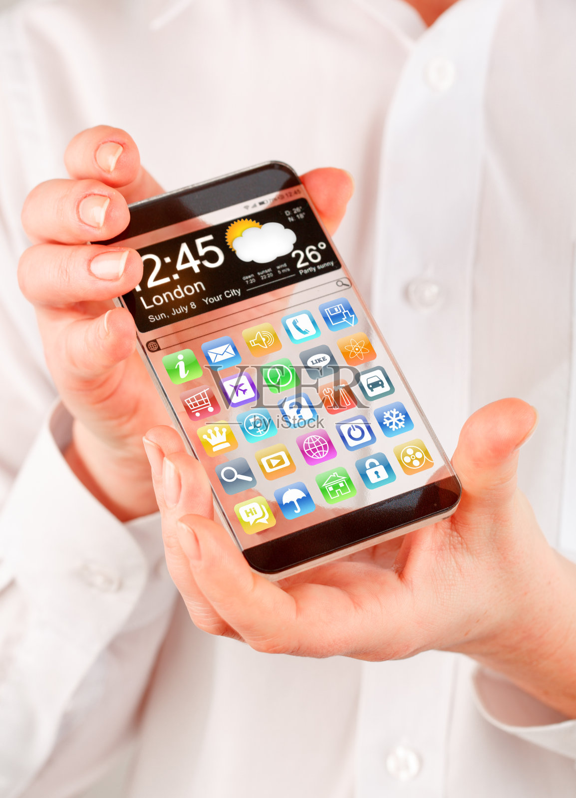 手握透明屏幕的智能手机。照片摄影图片