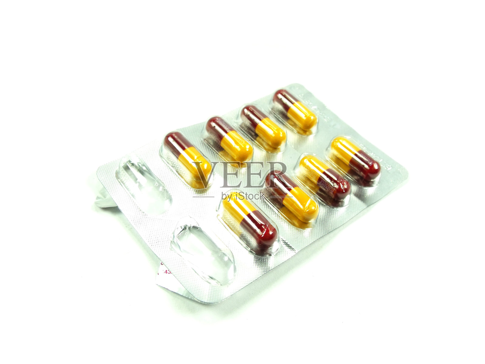 包装胶囊红色和黄色的背景照片摄影图片