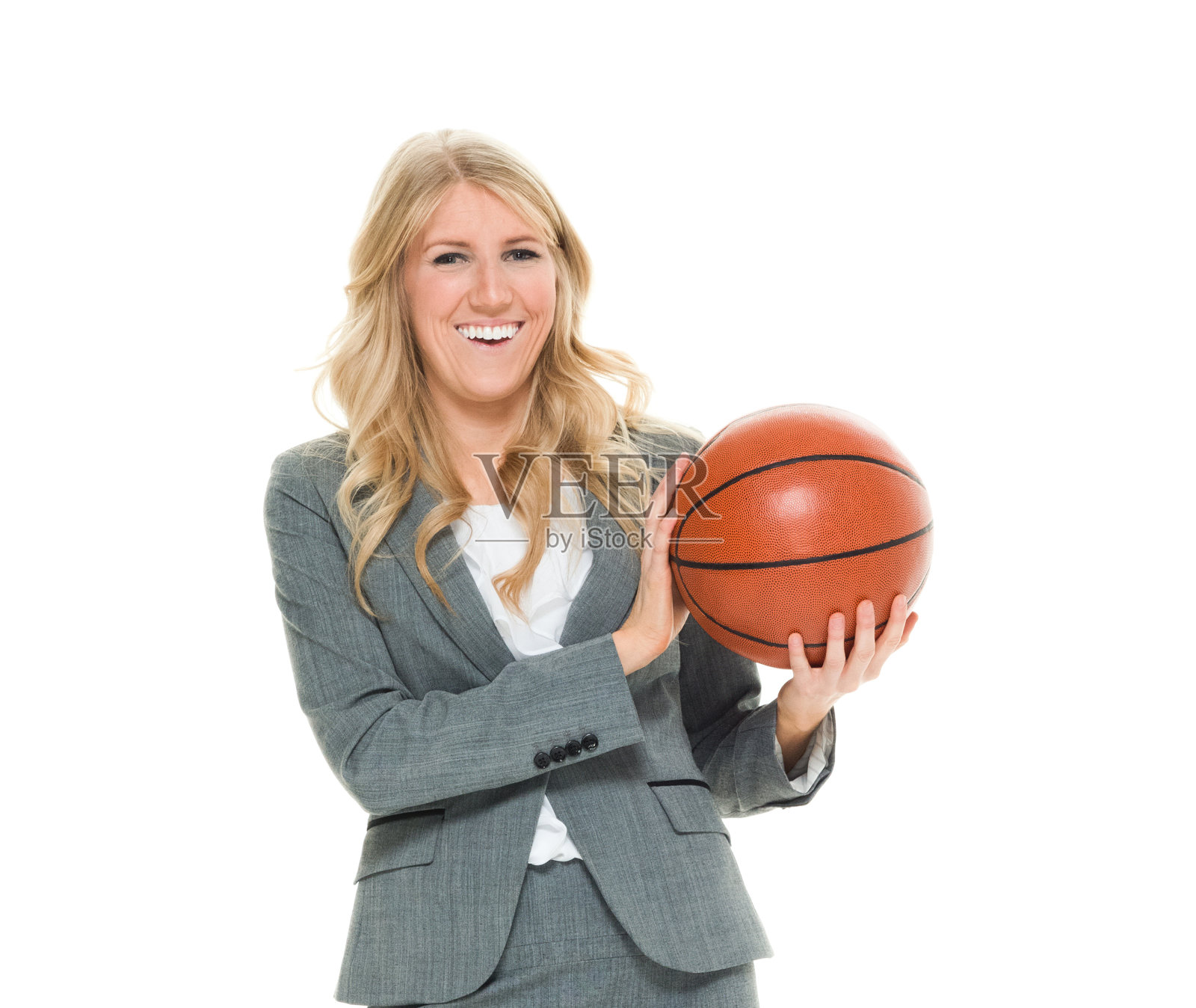 兴高采烈的女商人拿着篮球照片摄影图片