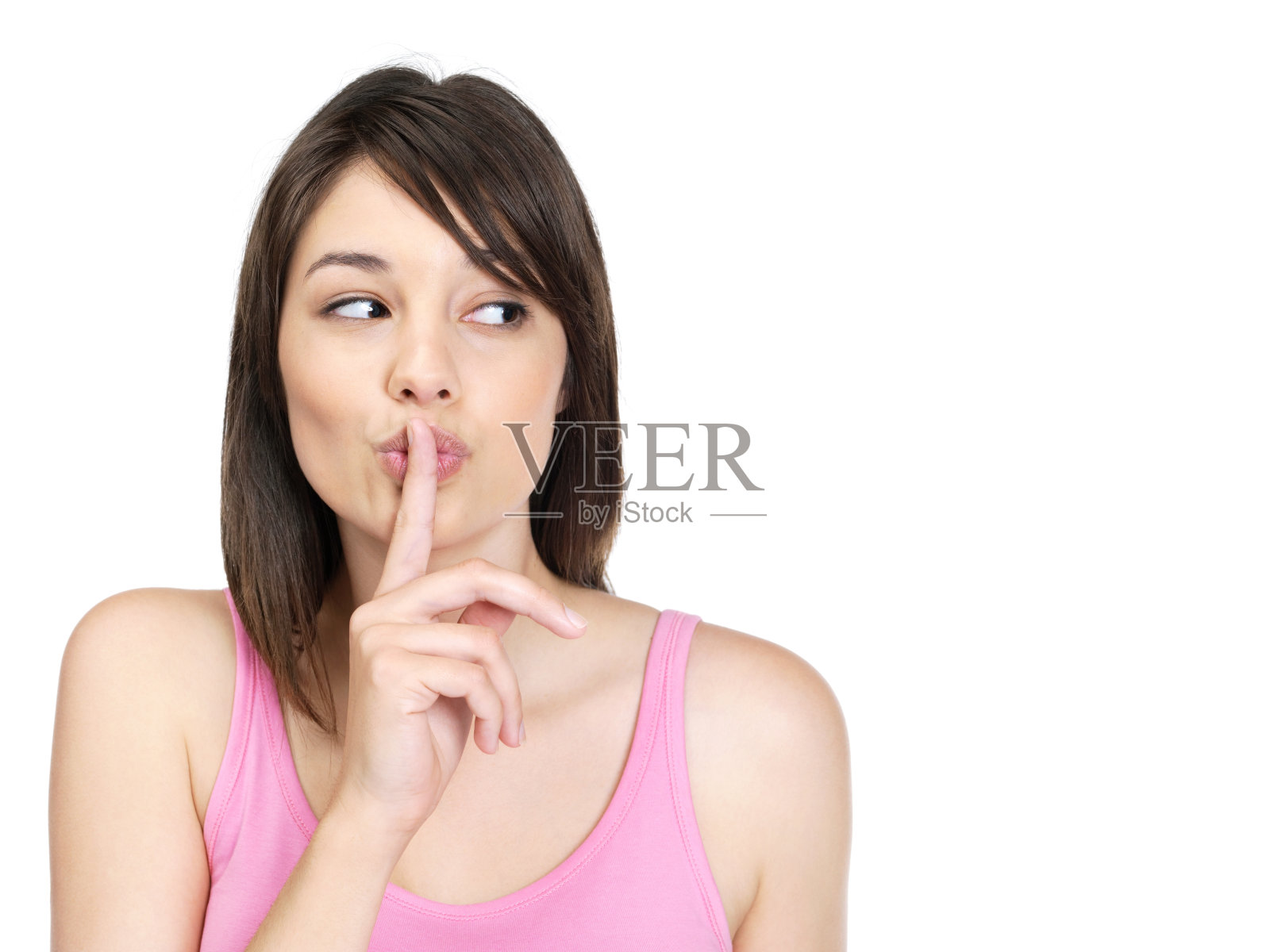 沉默-漂亮的年轻女子手指放在嘴唇上照片摄影图片