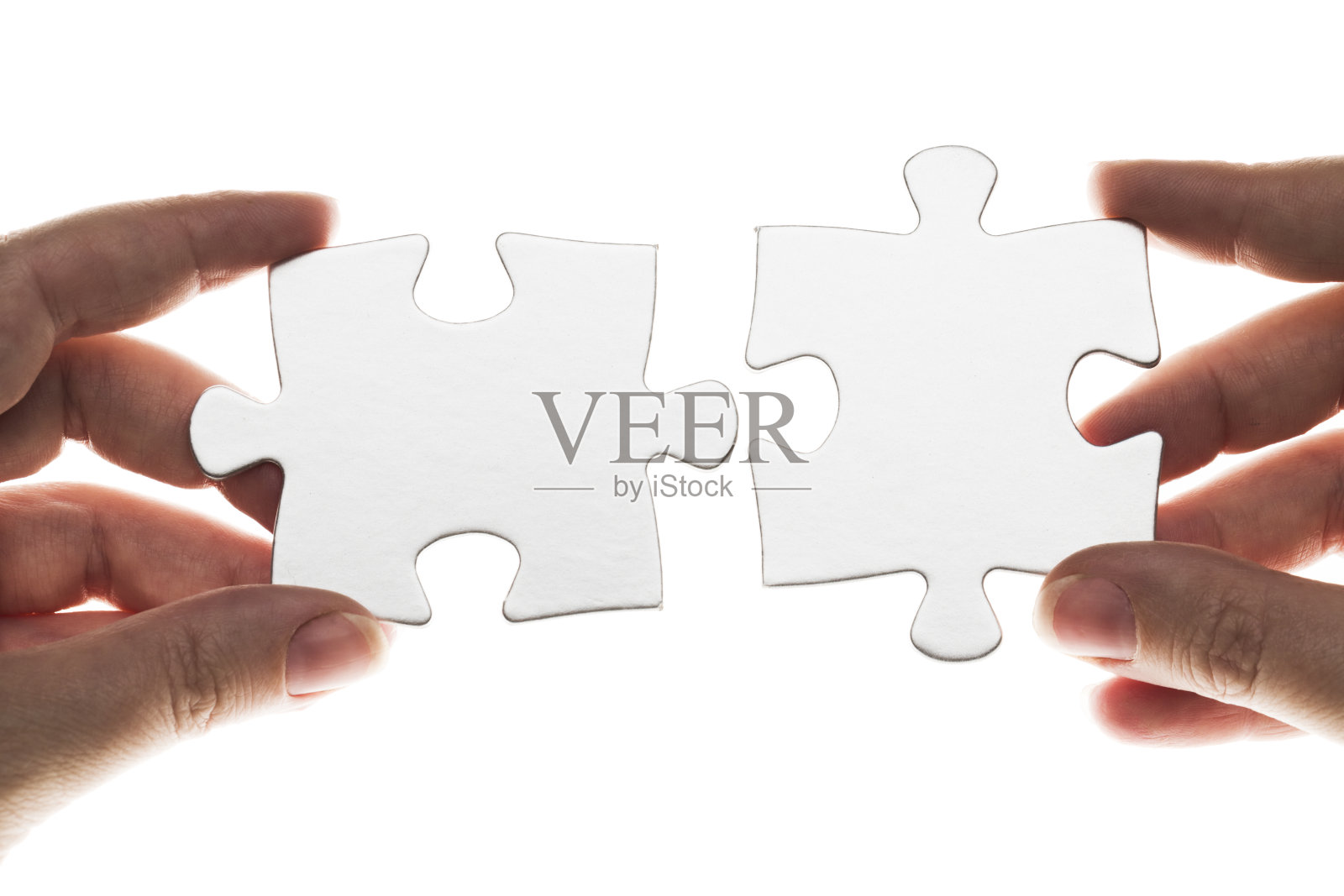 手握拼图照片摄影图片